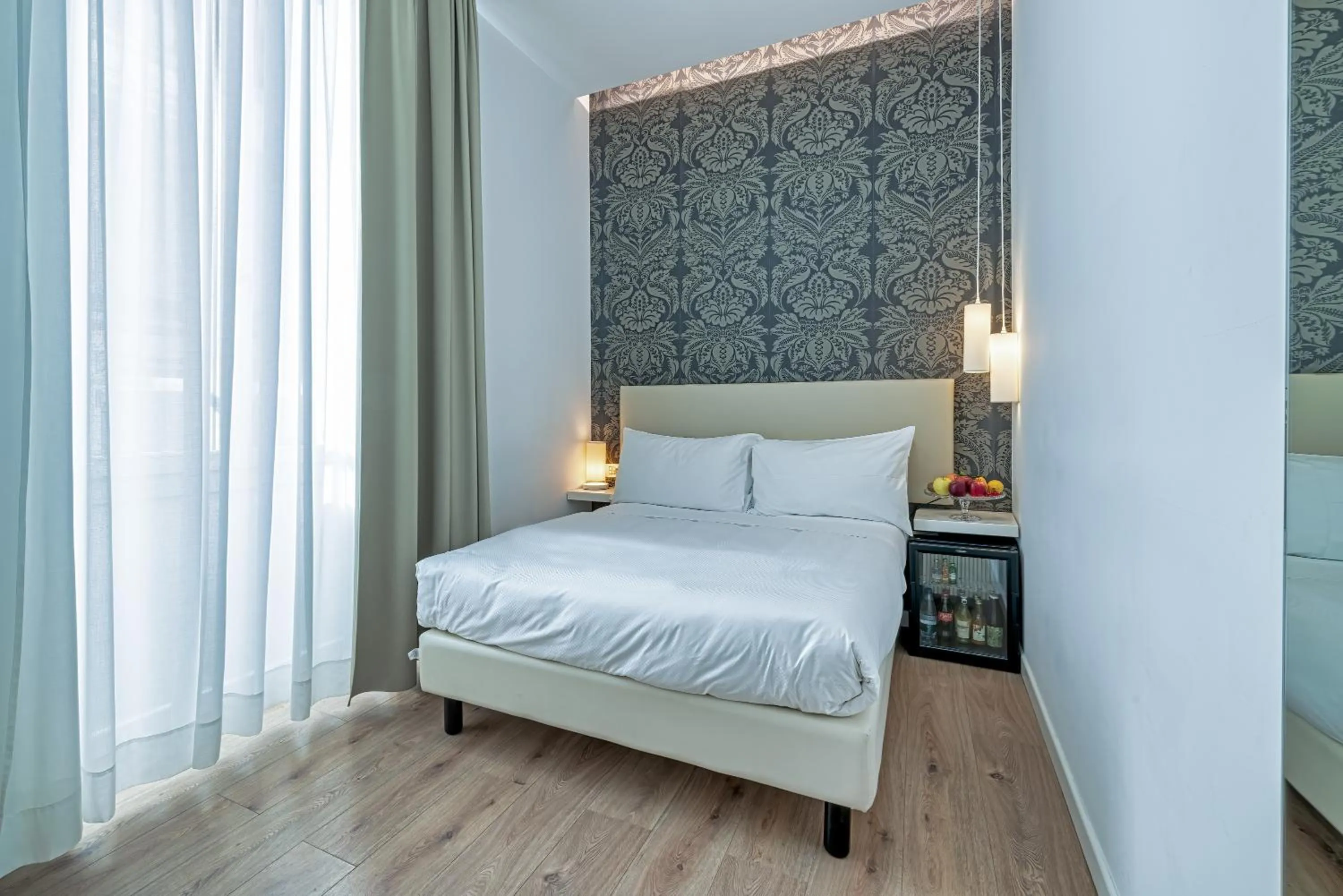 Bed in Sanremo Luxury Suites