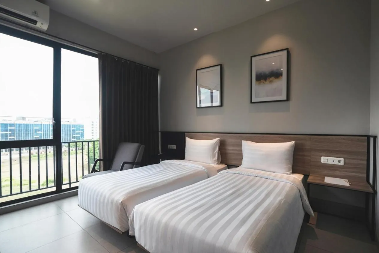 Bed in Conjioo Hotel Jakarta Managed by MHM