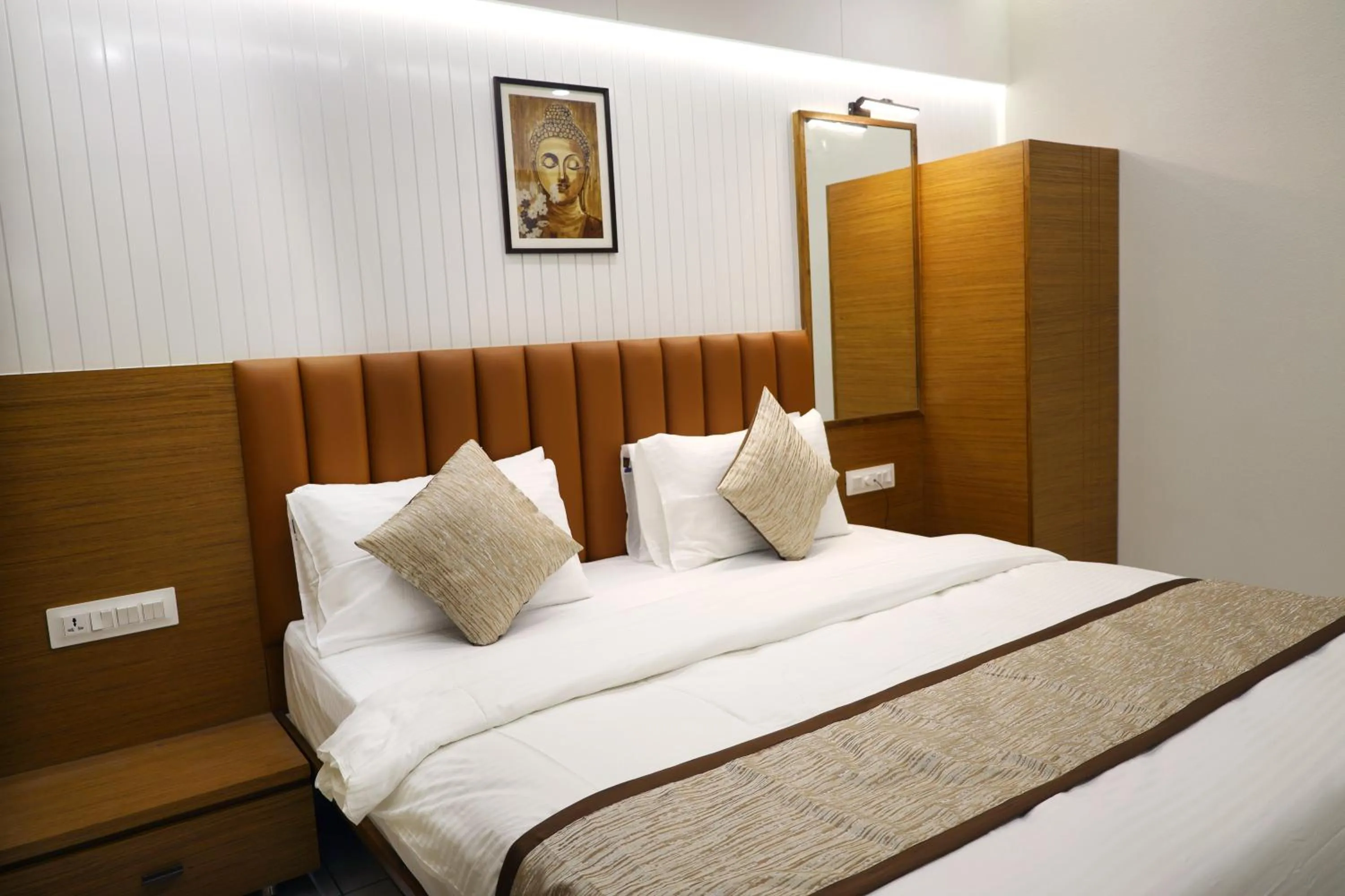 Bedroom in Tulsi Hotel