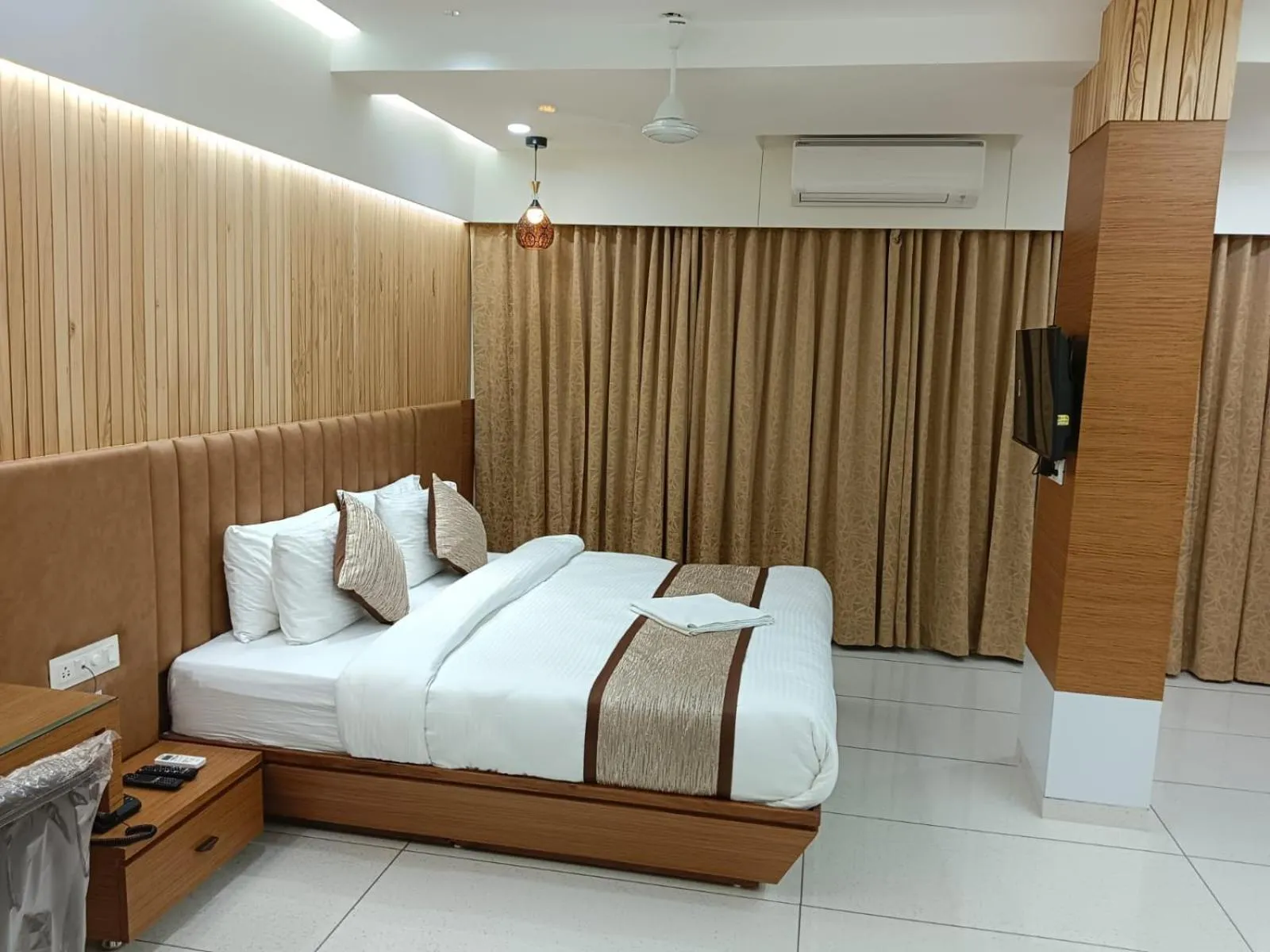 Bed in Tulsi Hotel