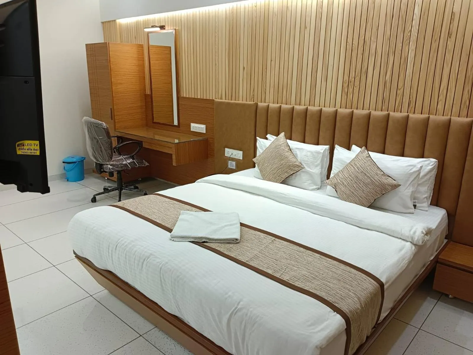 Bed in Tulsi Hotel
