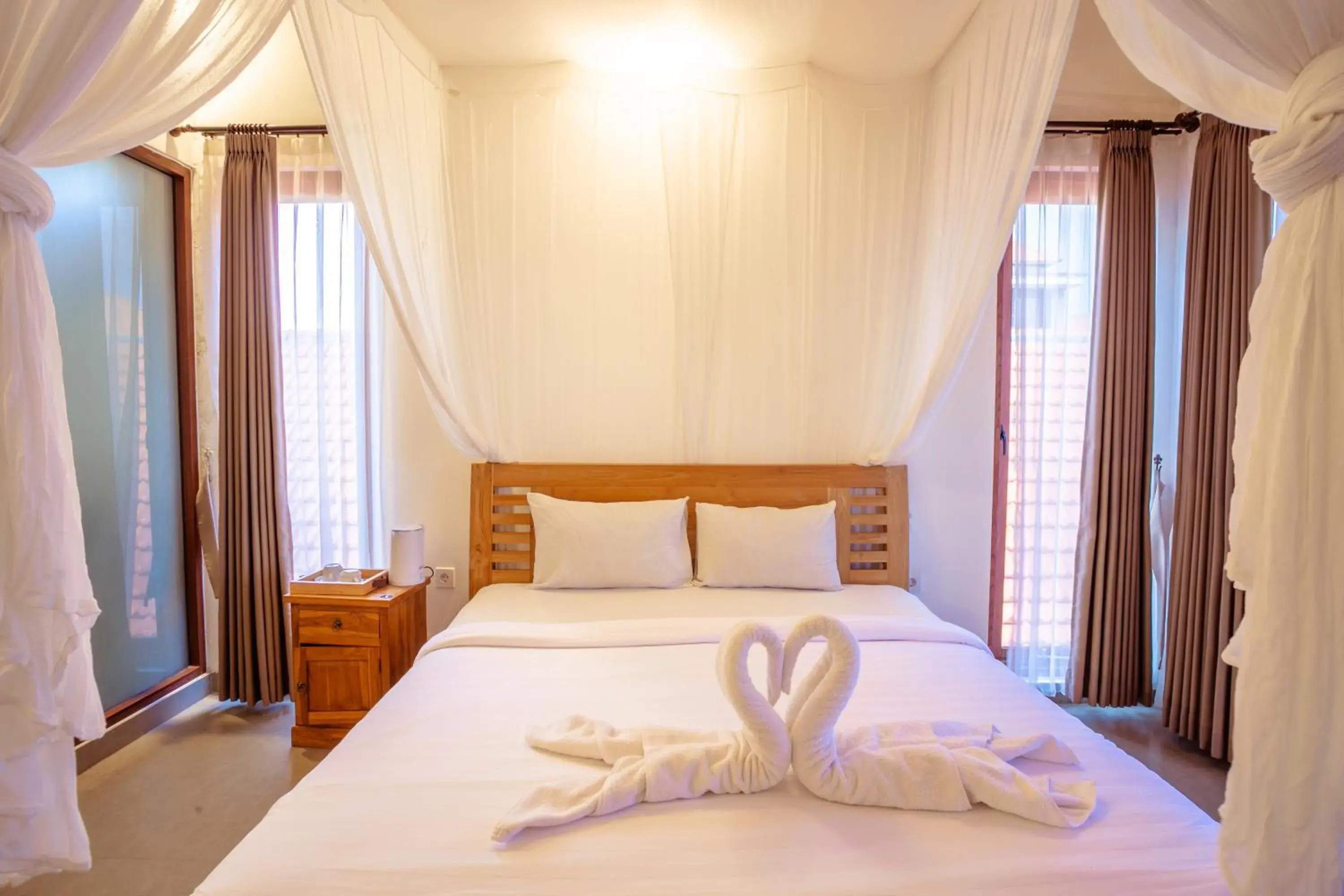 Bed in Kubu D'Carik Villa & Bungalow by ecommerceloka Bed in Kubu D'Carik Villa & Bungalow by ecommerceloka