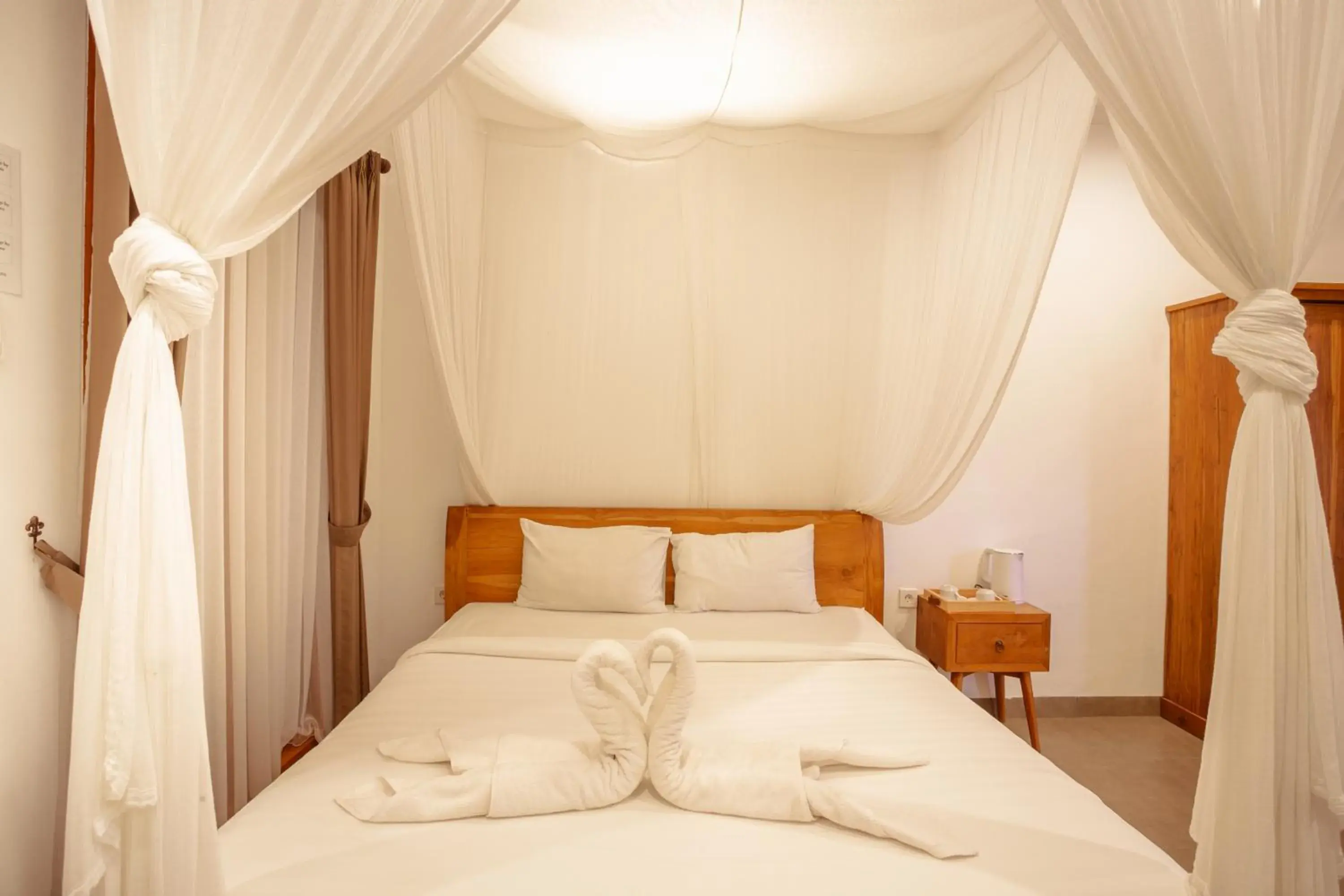 Bed in Kubu D'Carik Villa & Bungalow by ecommerceloka Bed in Kubu D'Carik Villa & Bungalow by ecommerceloka