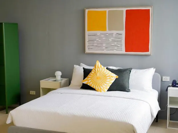 Bed in Emerald Manor Hotel