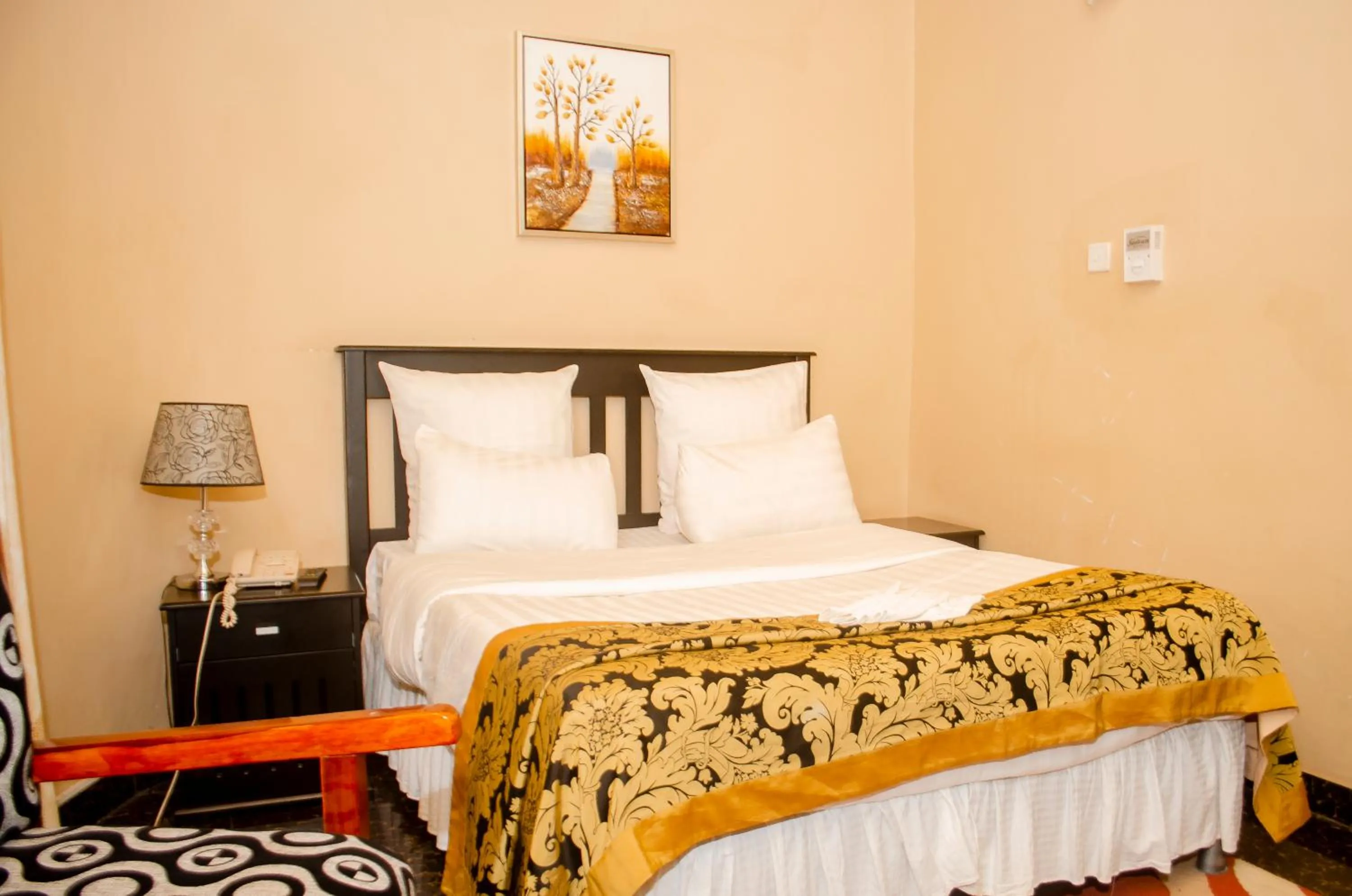 Bed in ROYAL SHALOM HOTEL