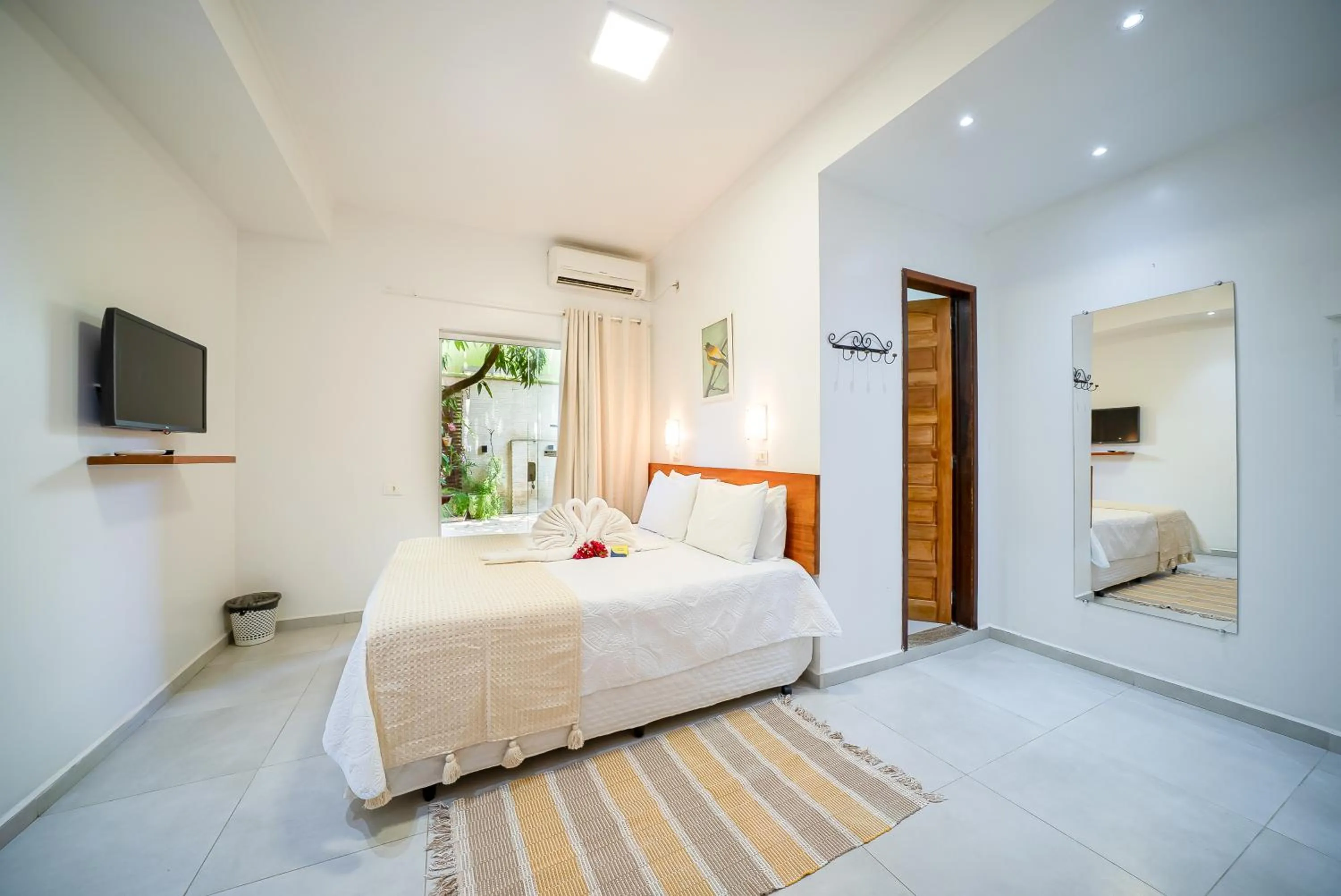 Bed in Pousada Som dos Pássaros