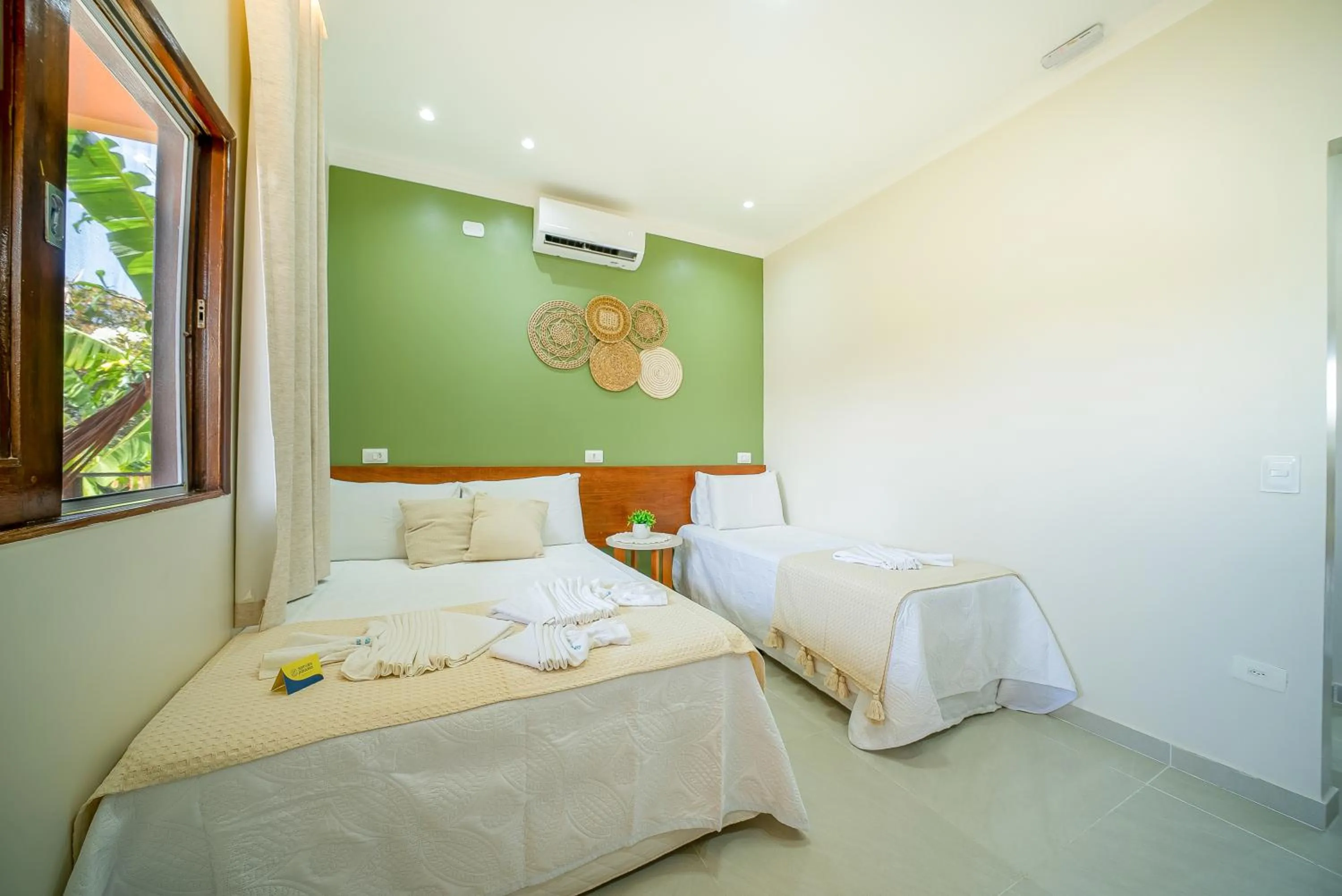 Bed in Pousada Som dos Pássaros