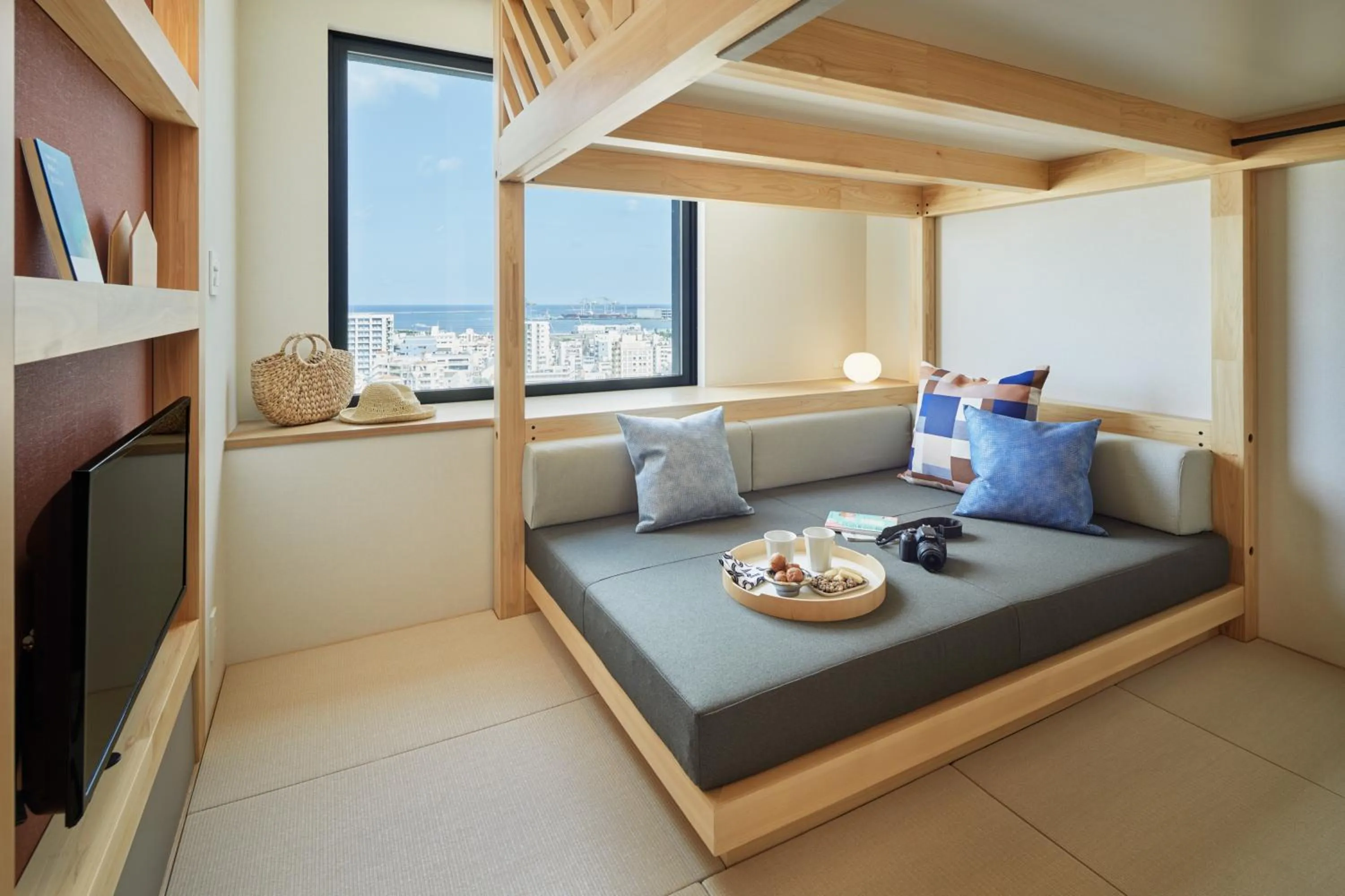 Living room, Bed in OMO5 Okinawa Naha by Hoshino Resorts