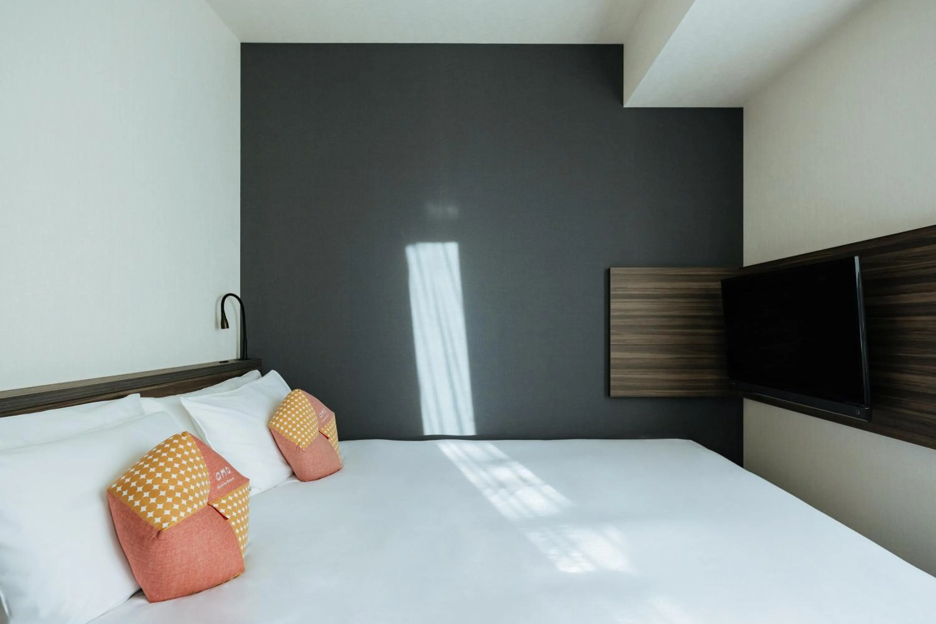 Bed in OMO3 Sapporo Susukino by Hoshino Resorts