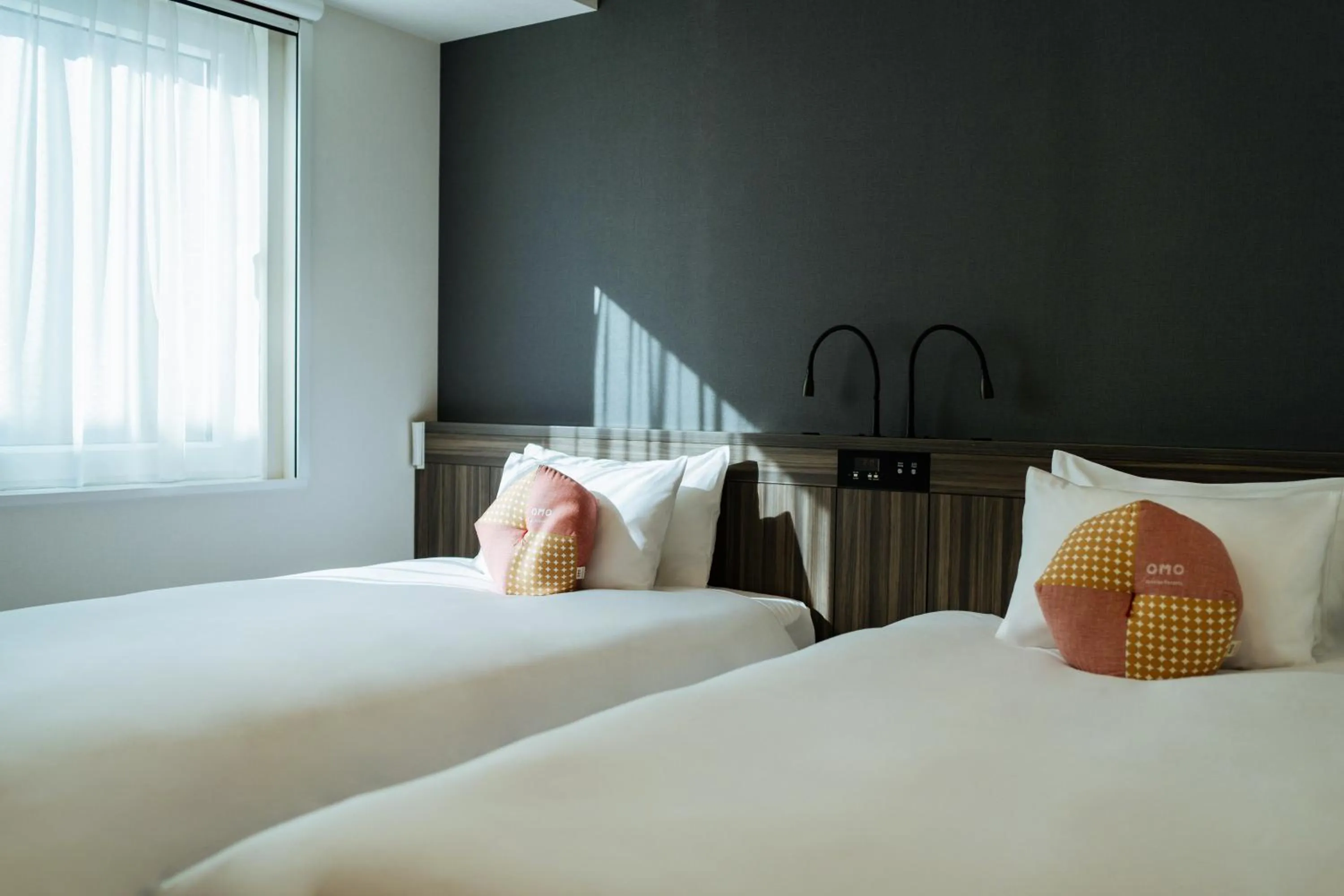 Bed in OMO3 Sapporo Susukino by Hoshino Resorts