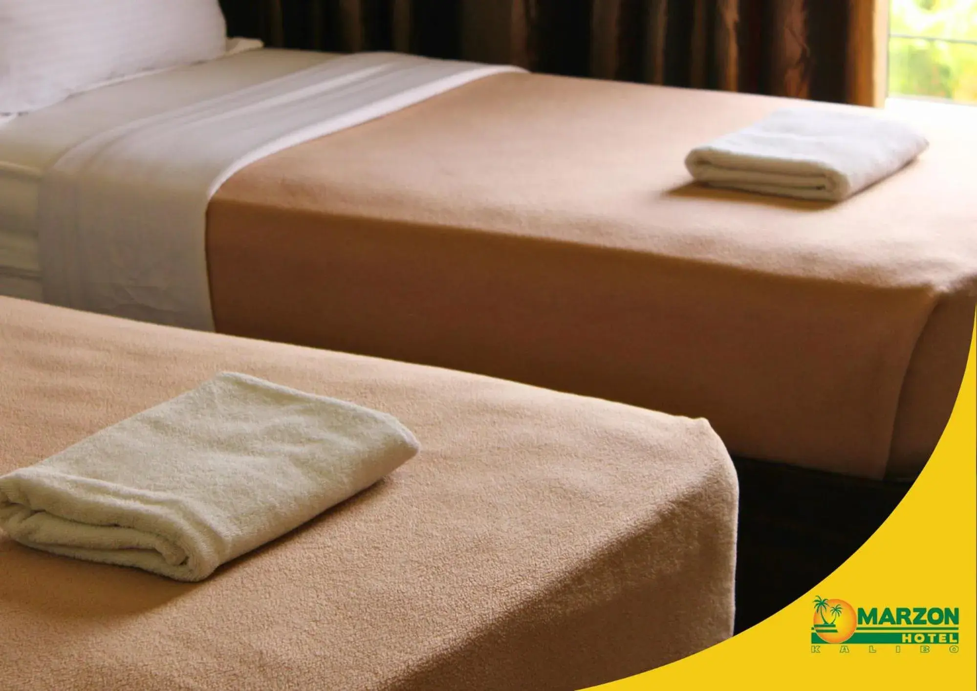 Bed in MARZON HOTEL KALIBO Bed in MARZON HOTEL KALIBO