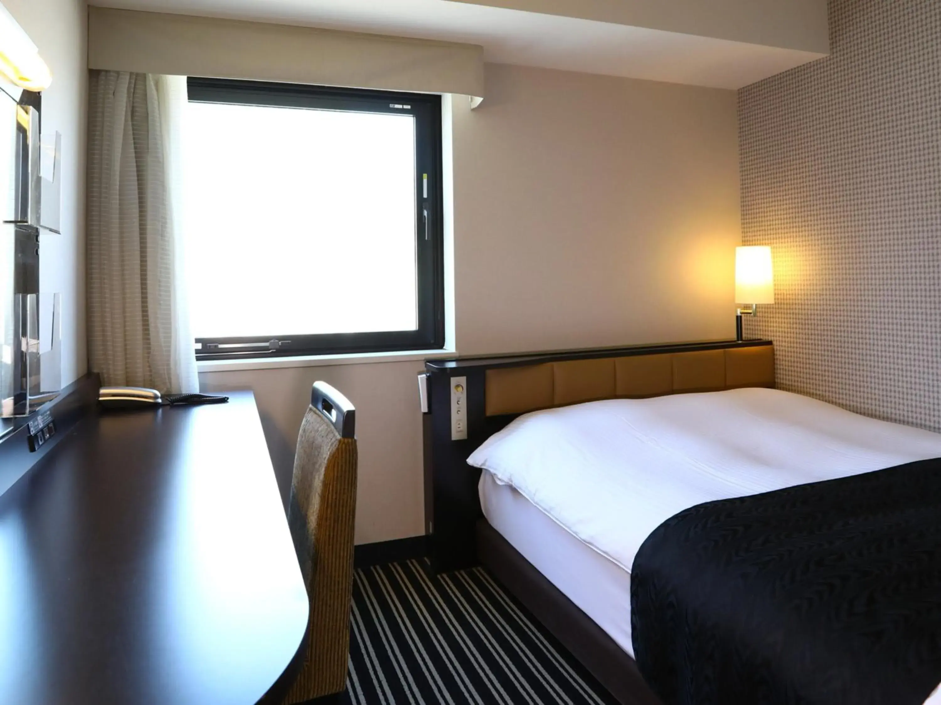 Bed in APA Hotel Shimbashi Toranomon Bed in APA Hotel Shimbashi Toranomon