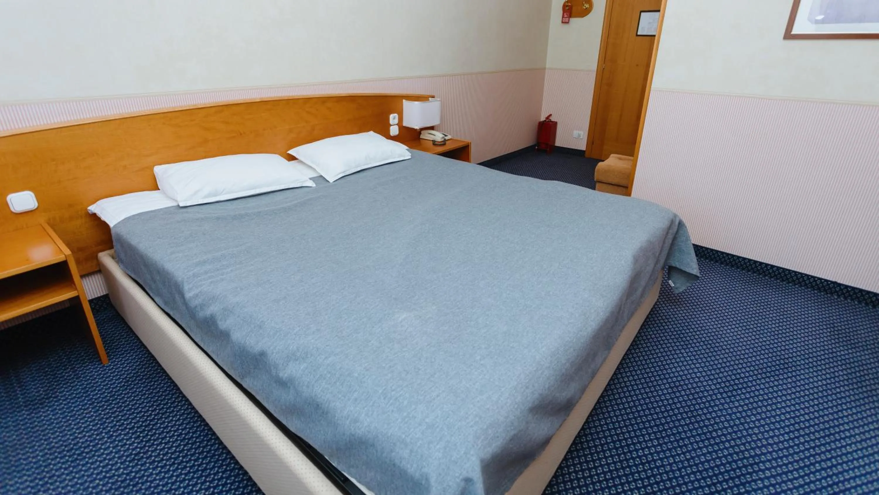 Bed in Marko Polo Hotel