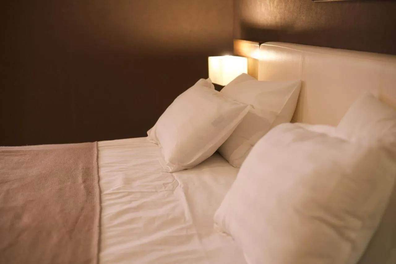 Bed in Marko Polo Hotel