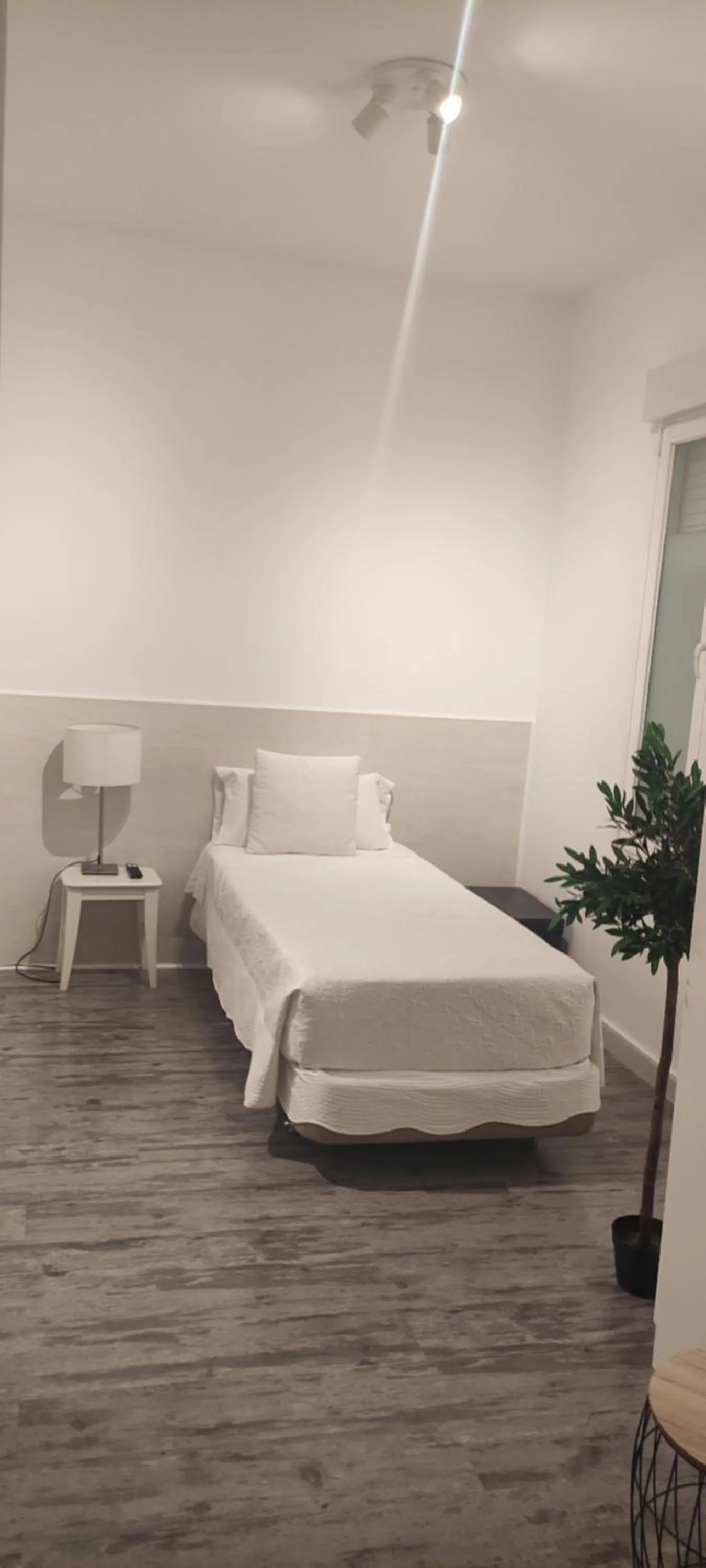 Bed in Hostal PETITE MAMAN