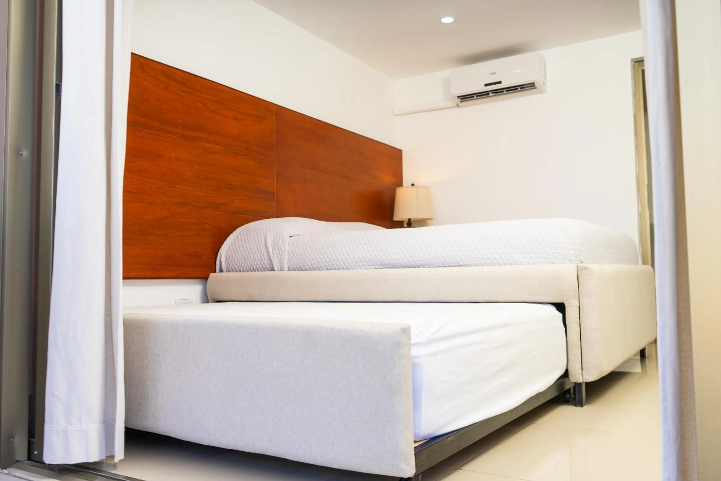 Bed in Equinoccio Hotel