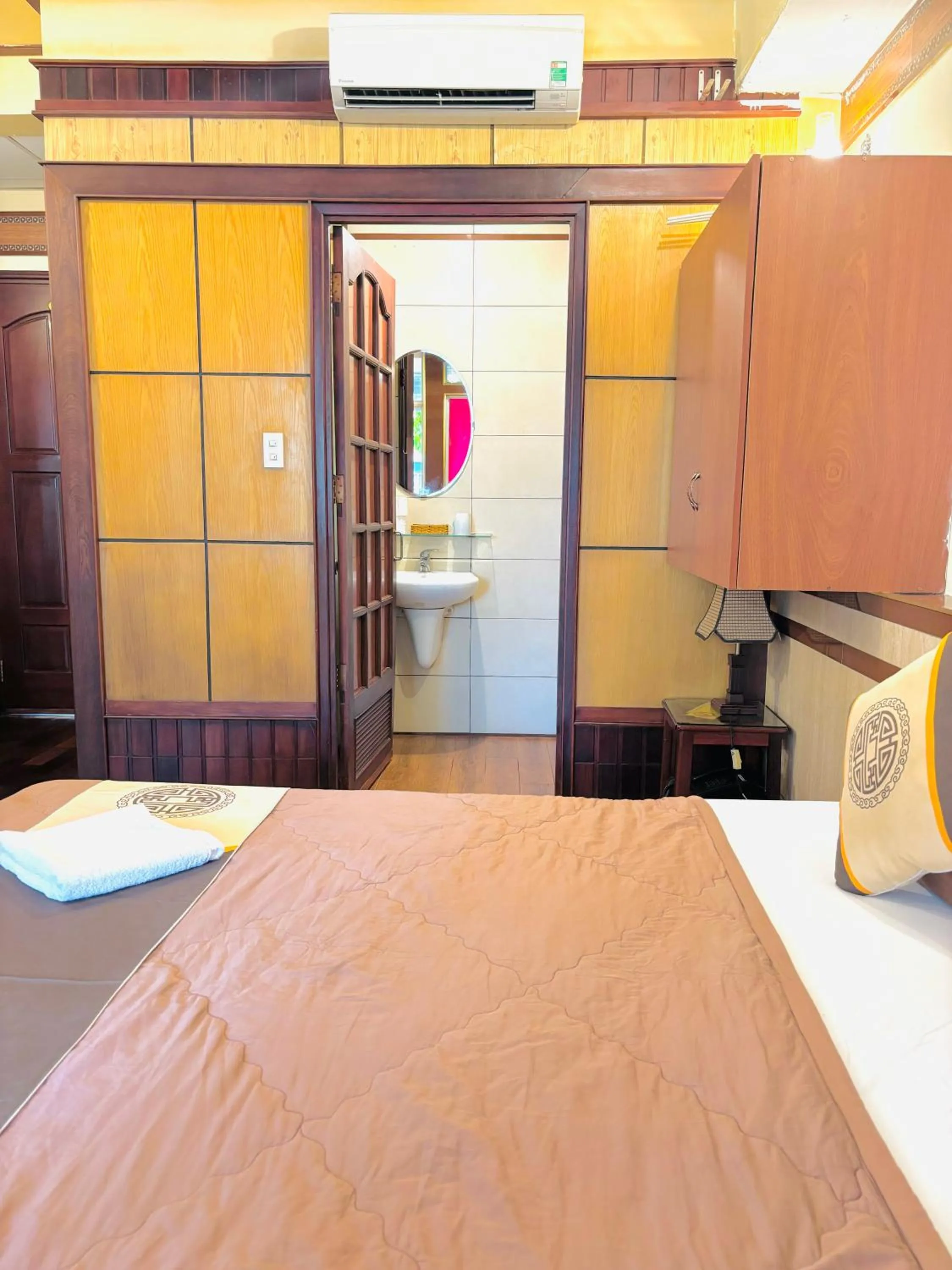 Bed in Bi Saigon Hotel