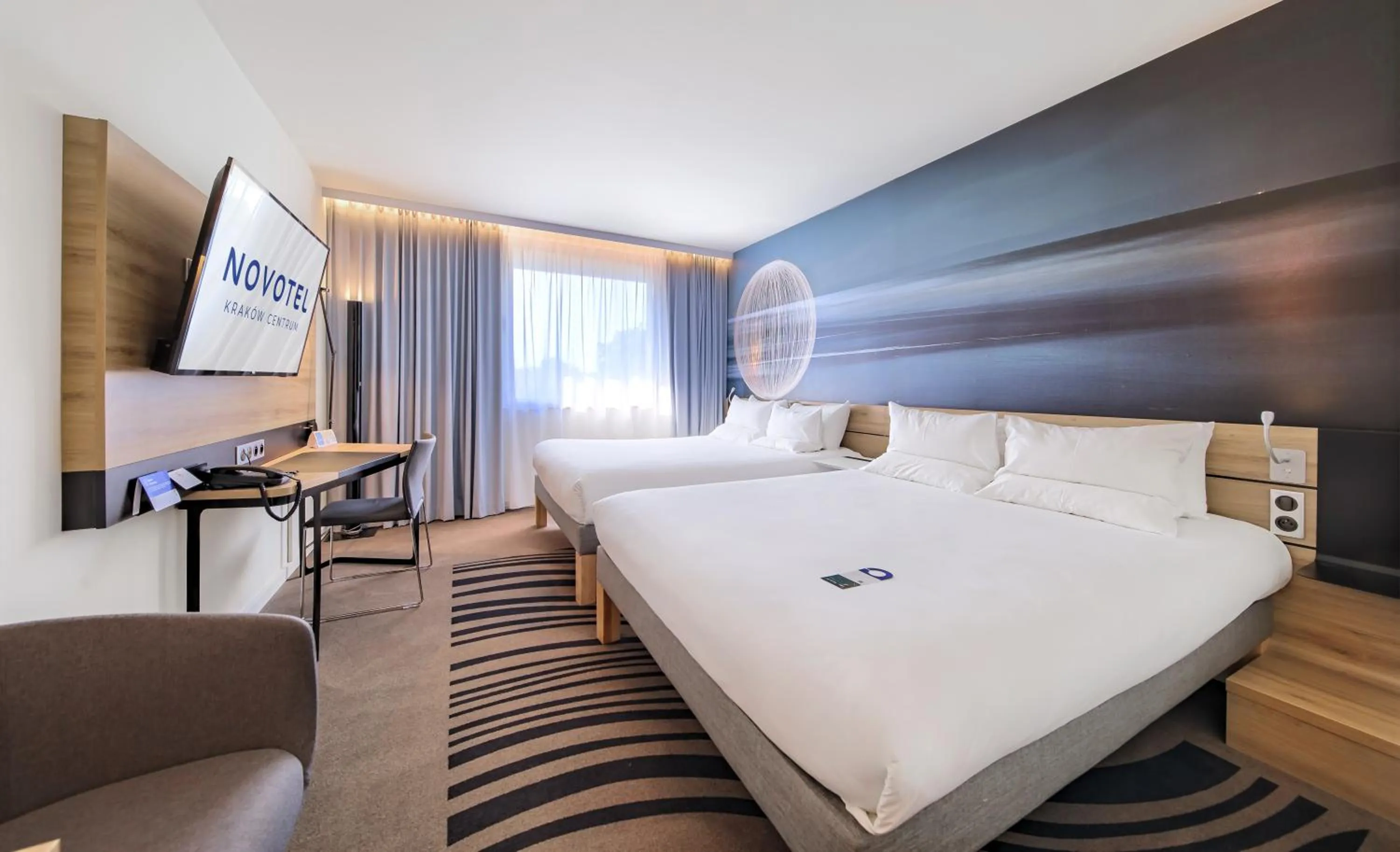 Seating area, Bed in Novotel Kraków Centrum