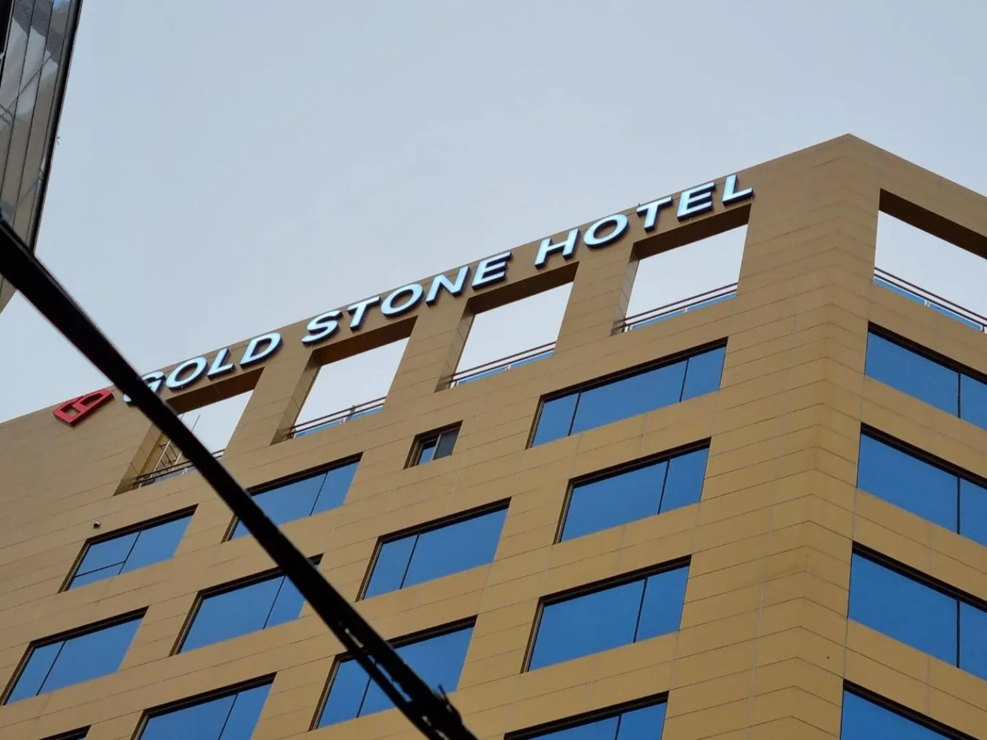 Property logo or sign in Gold Stone Hotel