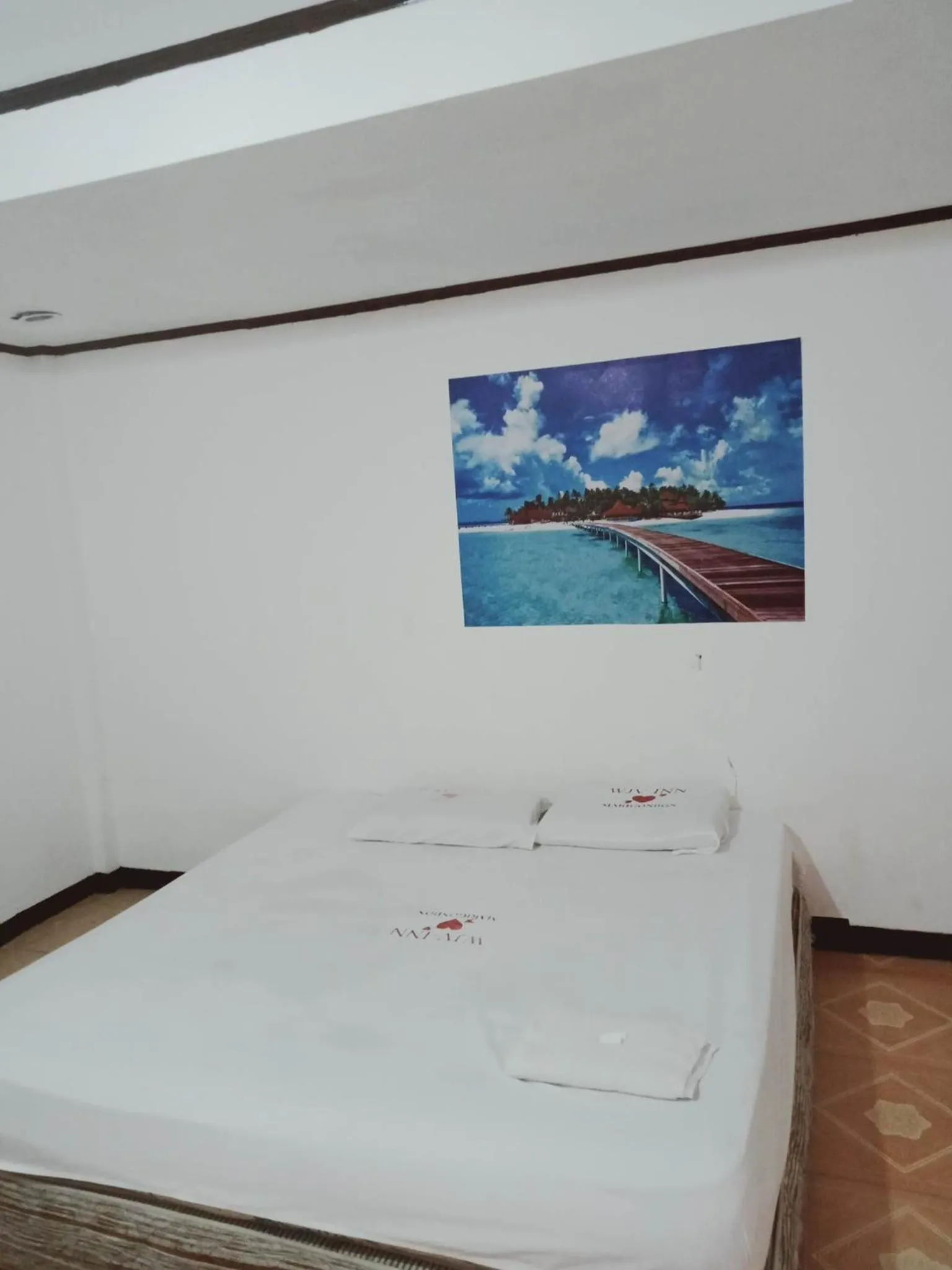 Bed in WJV INN Marigondon