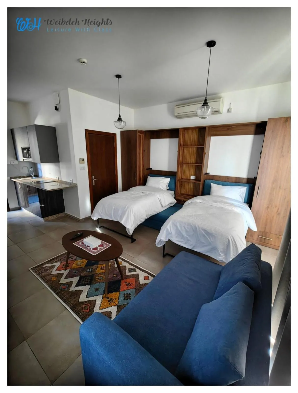Seating area, Bed in Weibdeh Heights Hotel Suites
