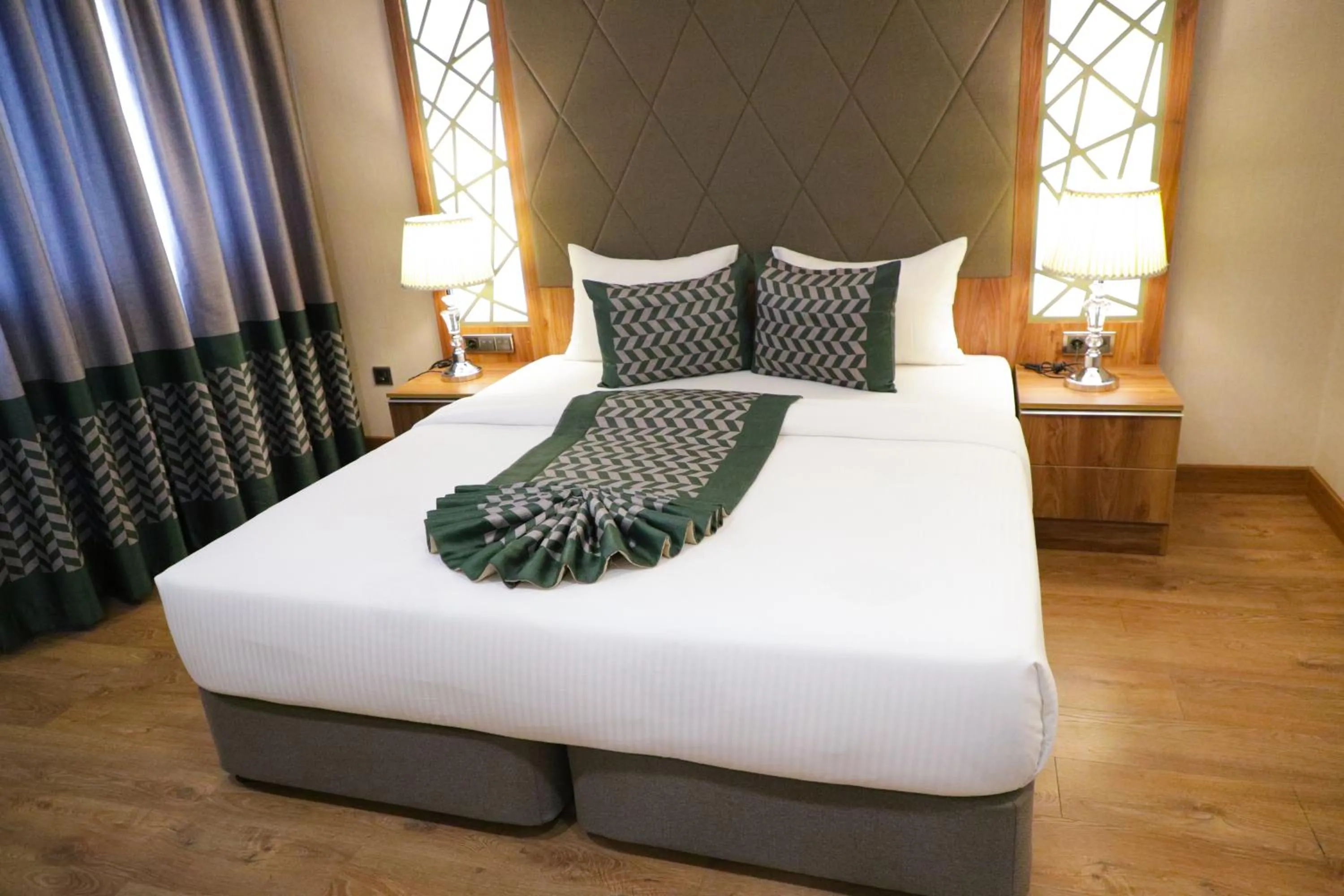 Bed in UNITED HOTEL INTERNATIONAL