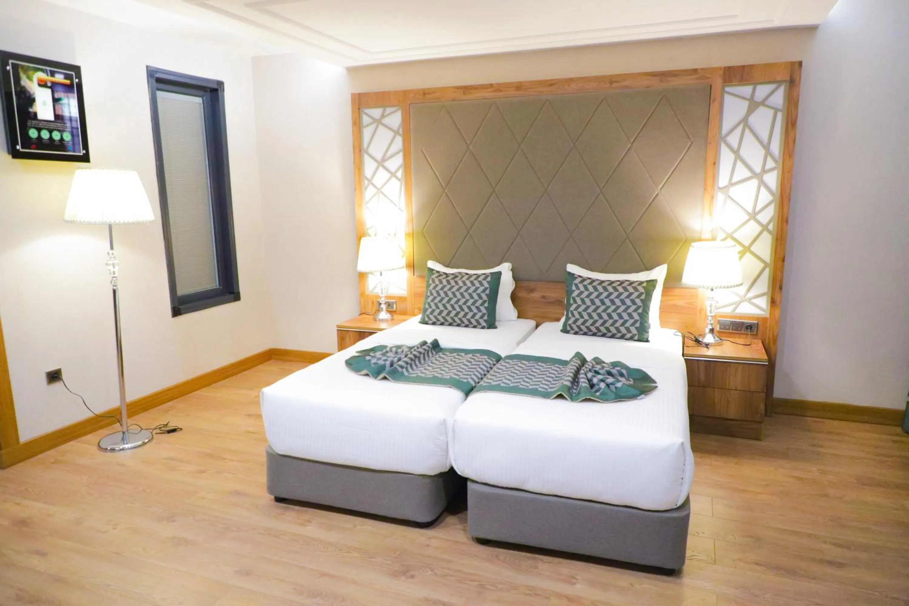 Bed in UNITED HOTEL INTERNATIONAL