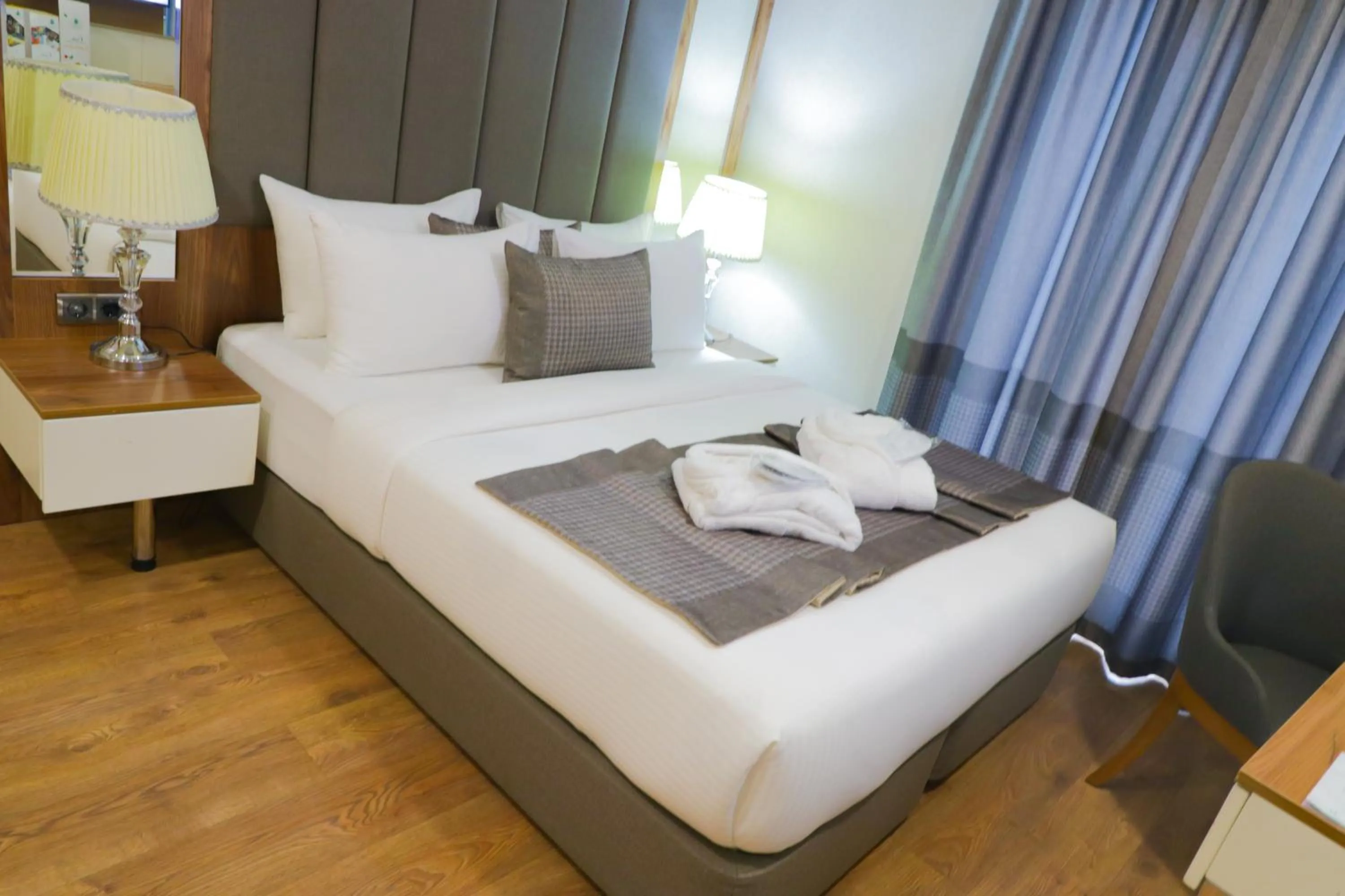 Bed in UNITED HOTEL INTERNATIONAL