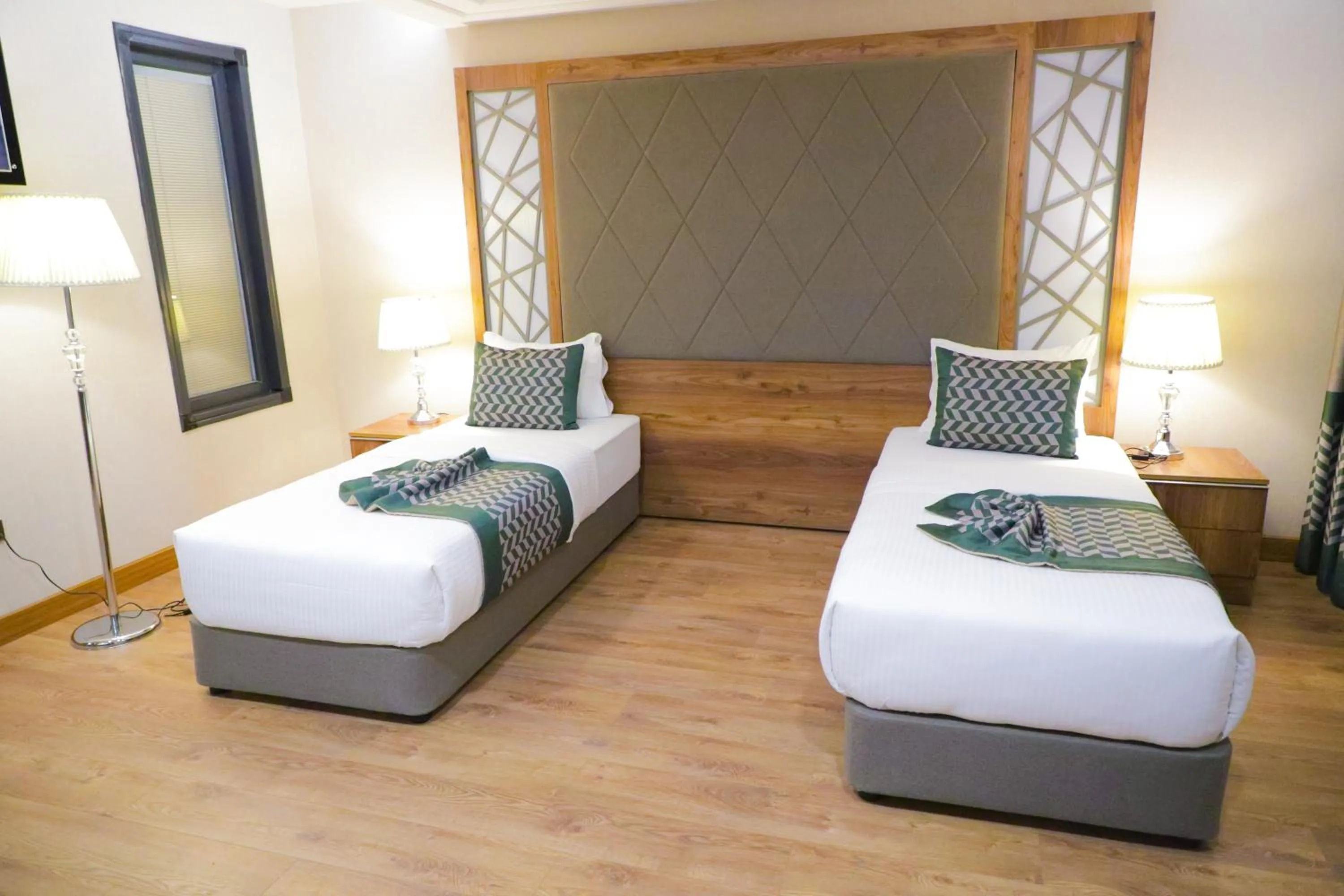 Bed in UNITED HOTEL INTERNATIONAL