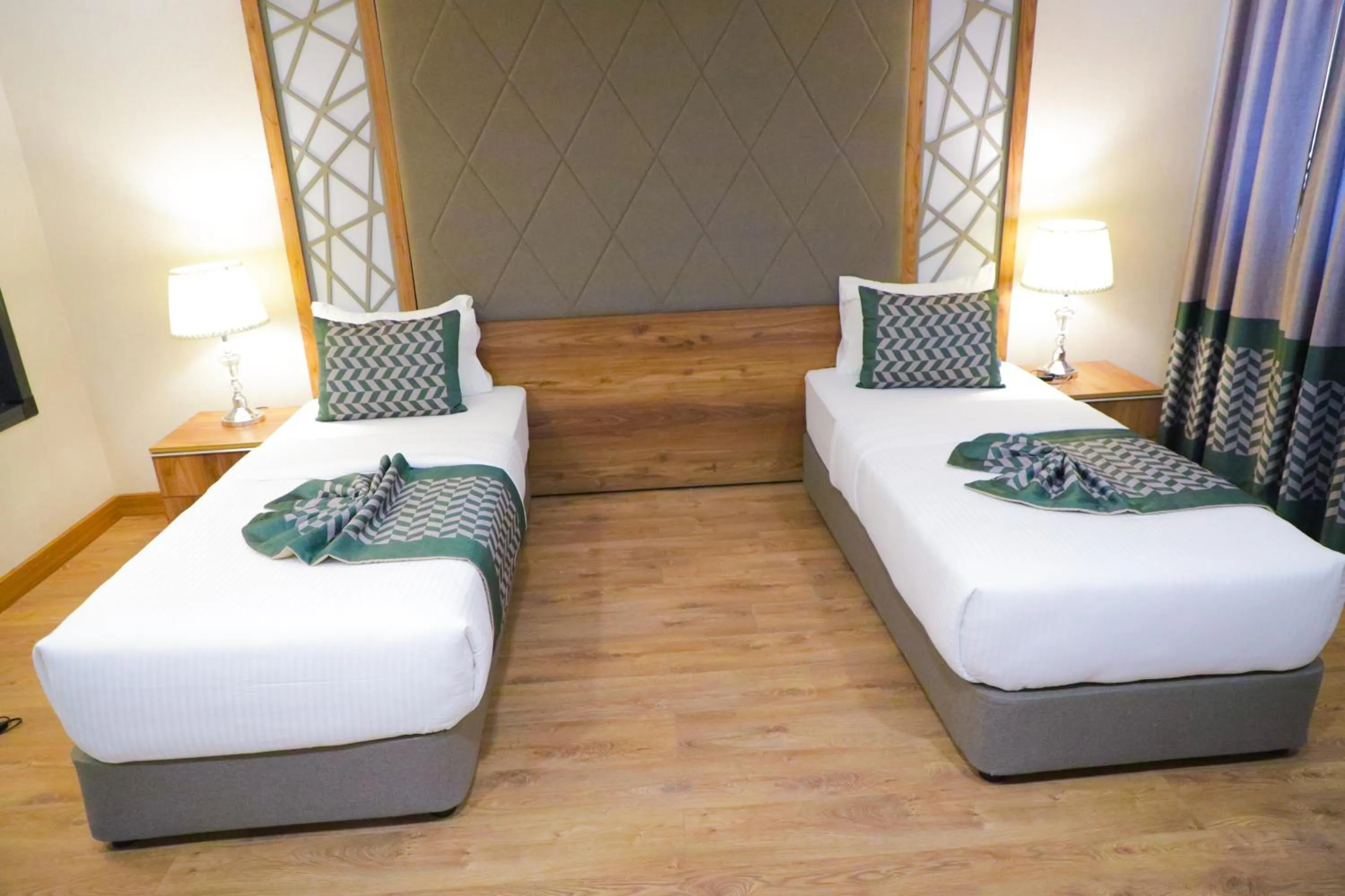 Bed in UNITED HOTEL INTERNATIONAL