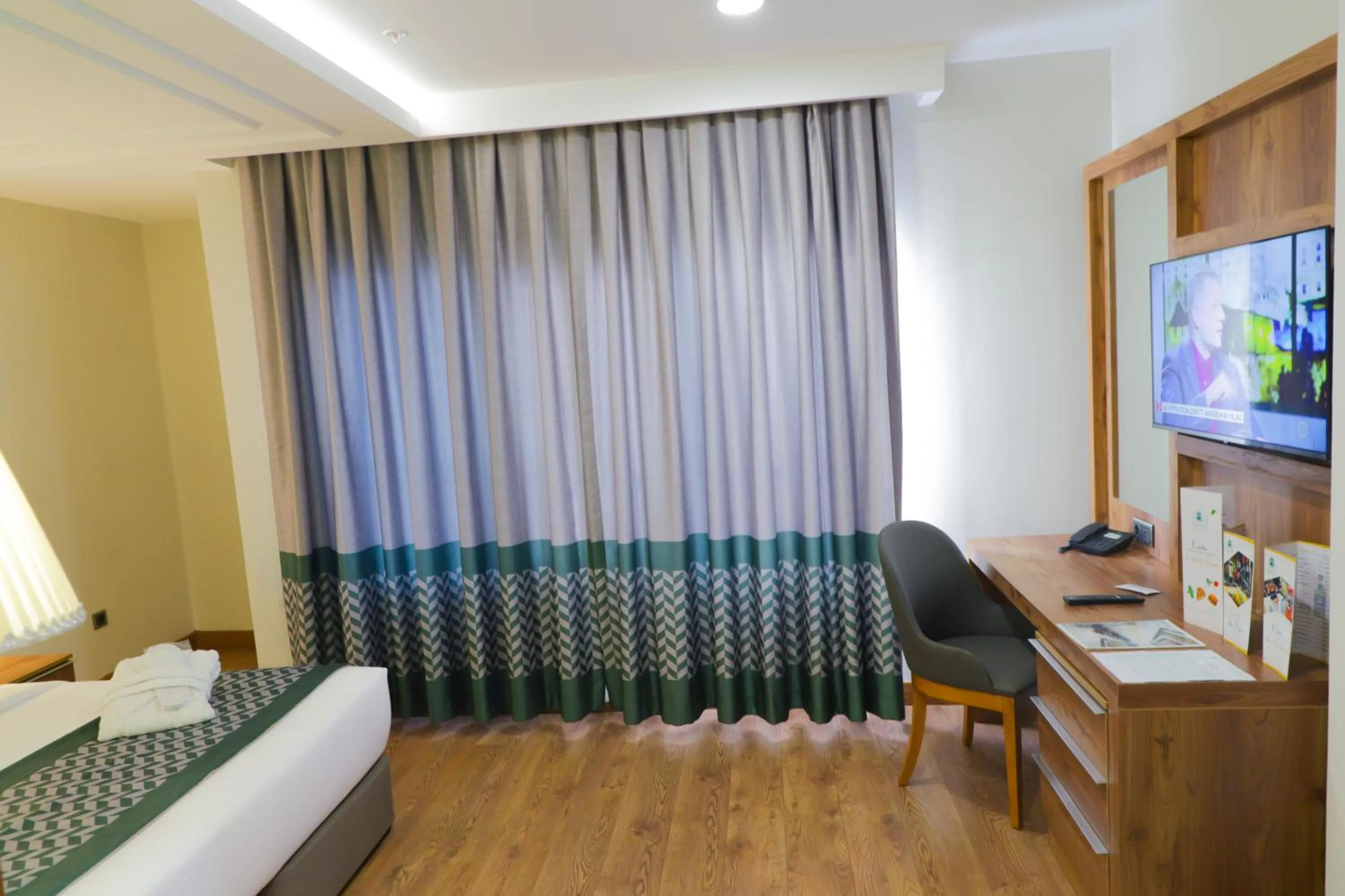 Bed in UNITED HOTEL INTERNATIONAL