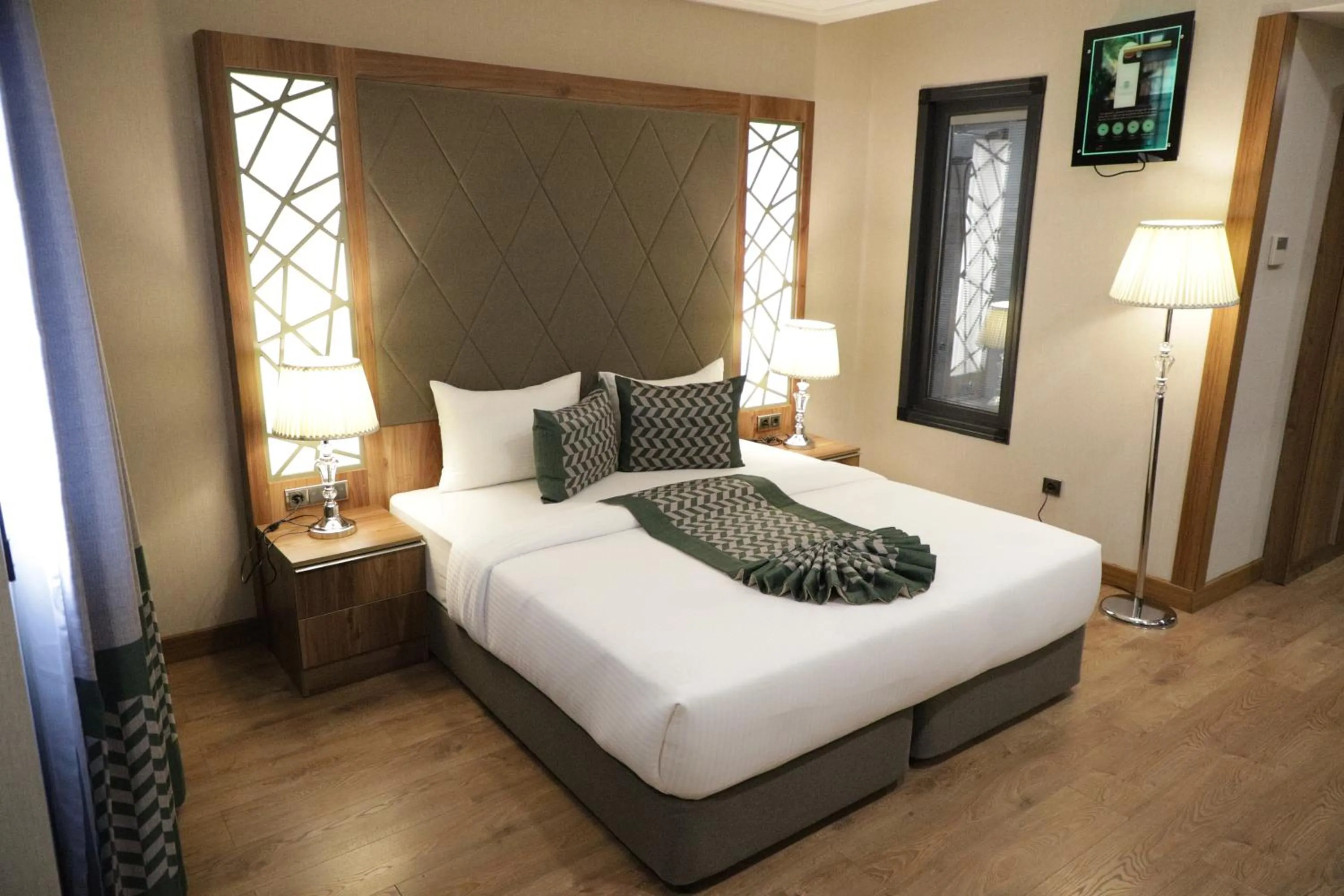 Bed in UNITED HOTEL INTERNATIONAL