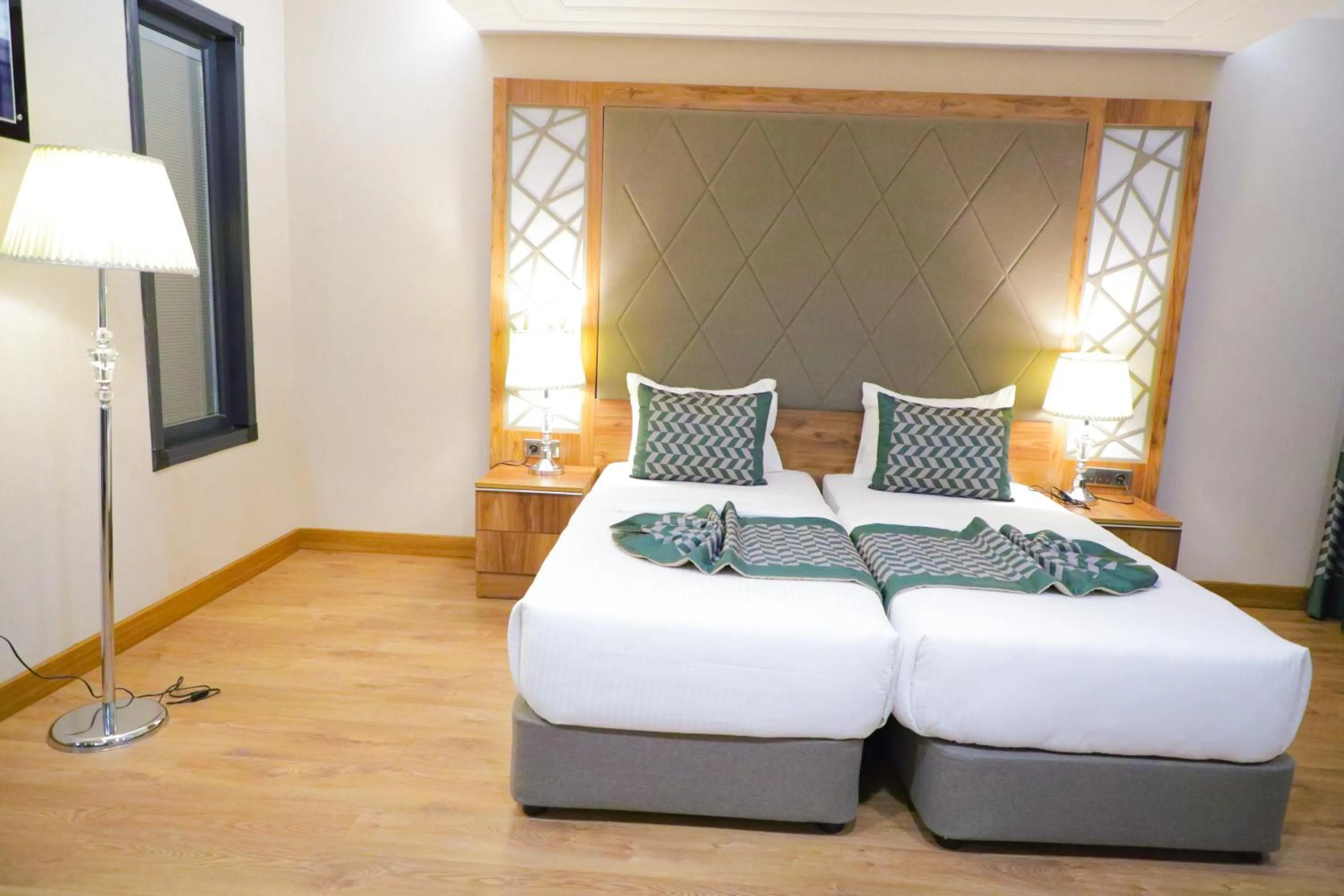 Bed in UNITED HOTEL INTERNATIONAL