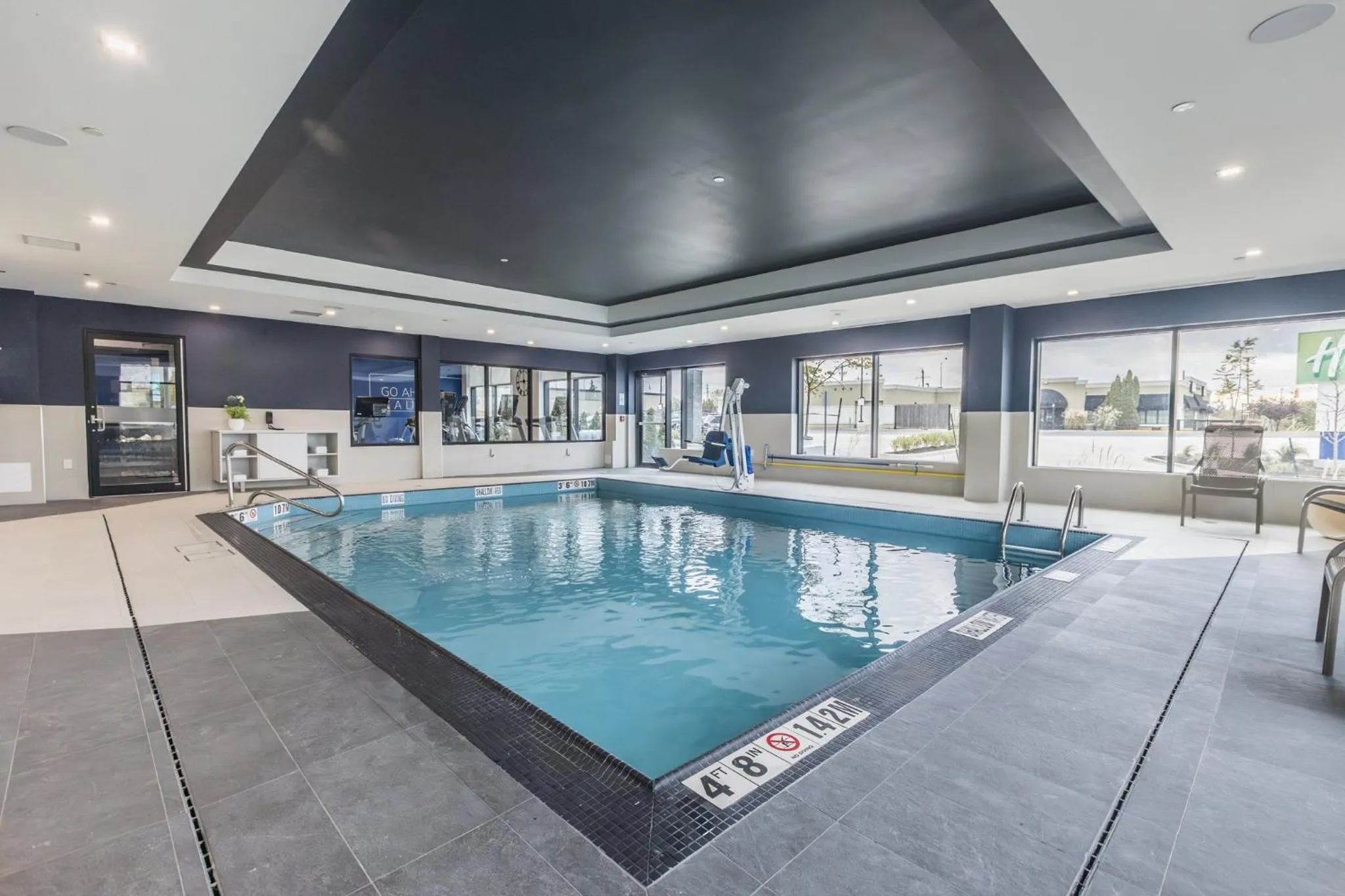 Swimming pool in Holiday Inn Express & Suites Toronto Airport South by IHG