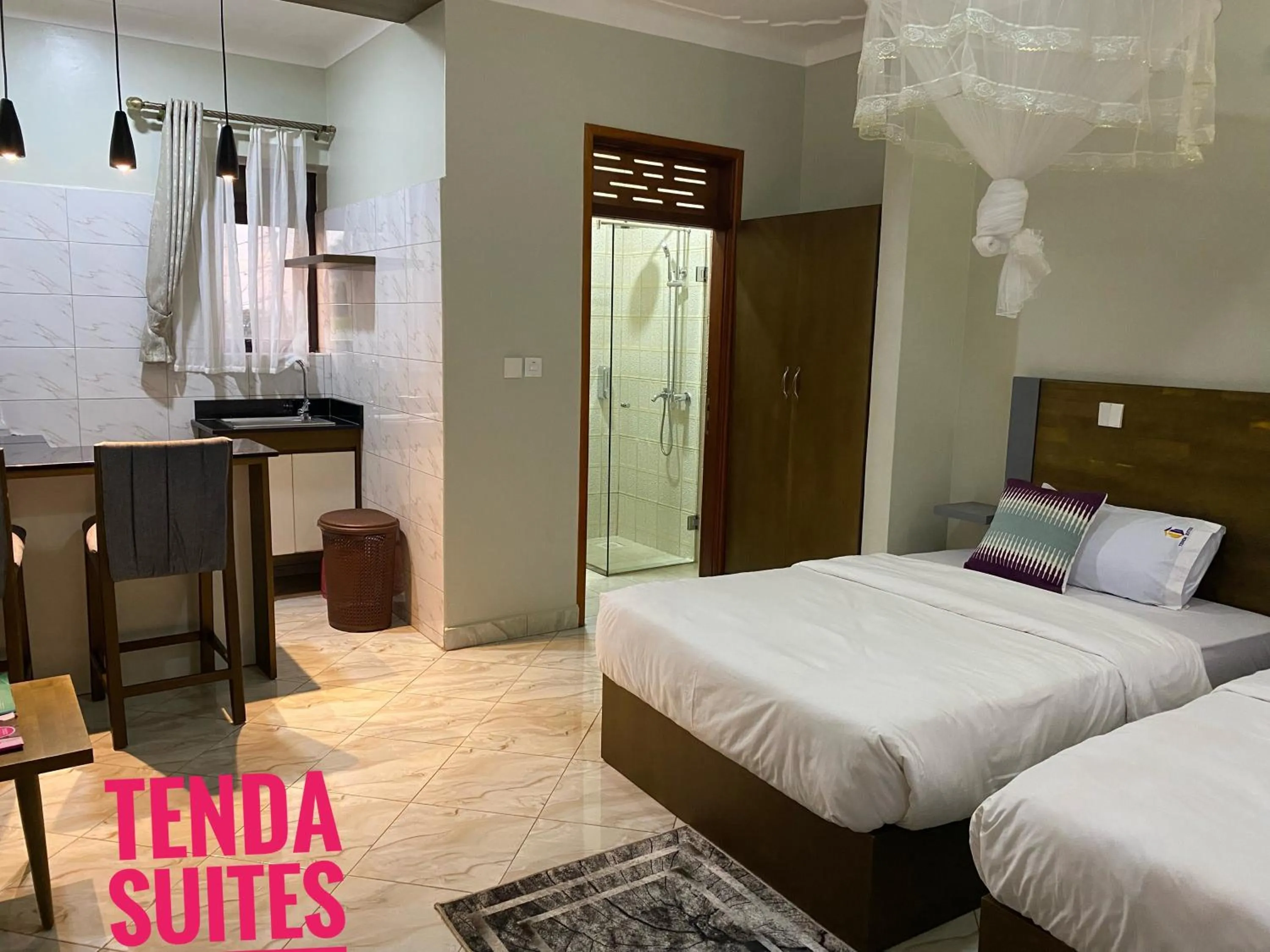 Bed in Tenda Suites and Restaurant