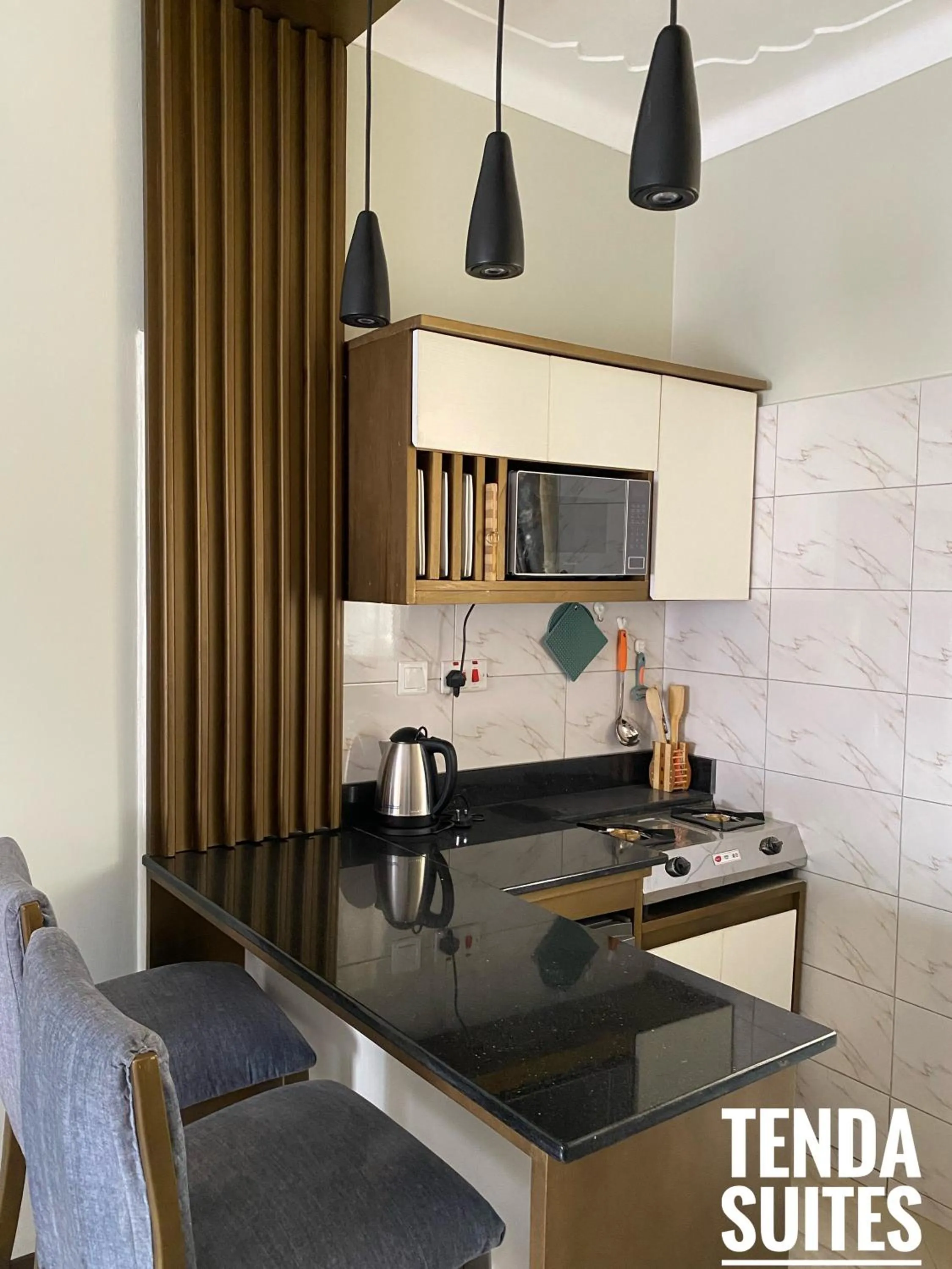Kitchen or kitchenette in Tenda Suites and Restaurant
