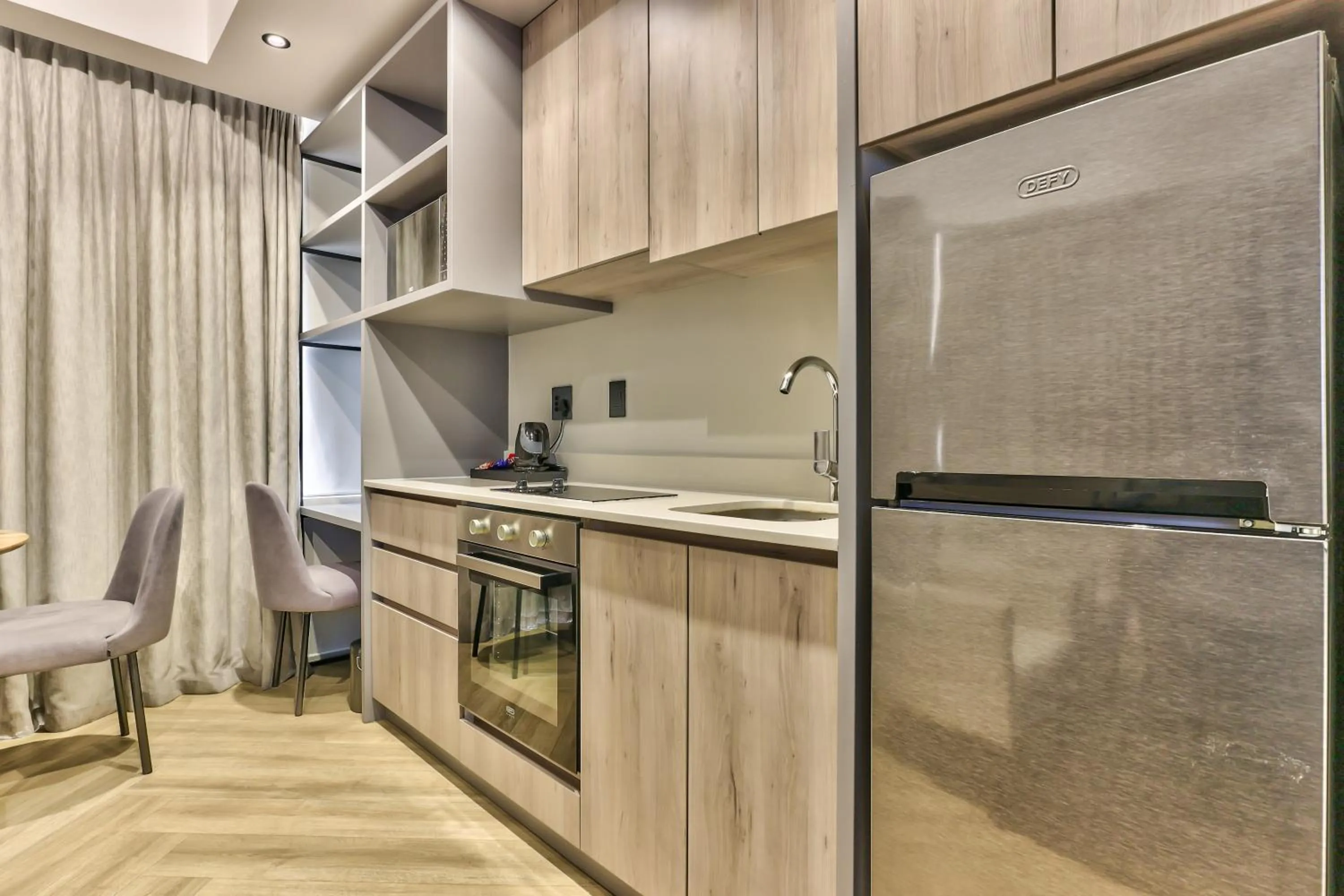 Kitchen or kitchenette in WINK Aparthotel One Thibault