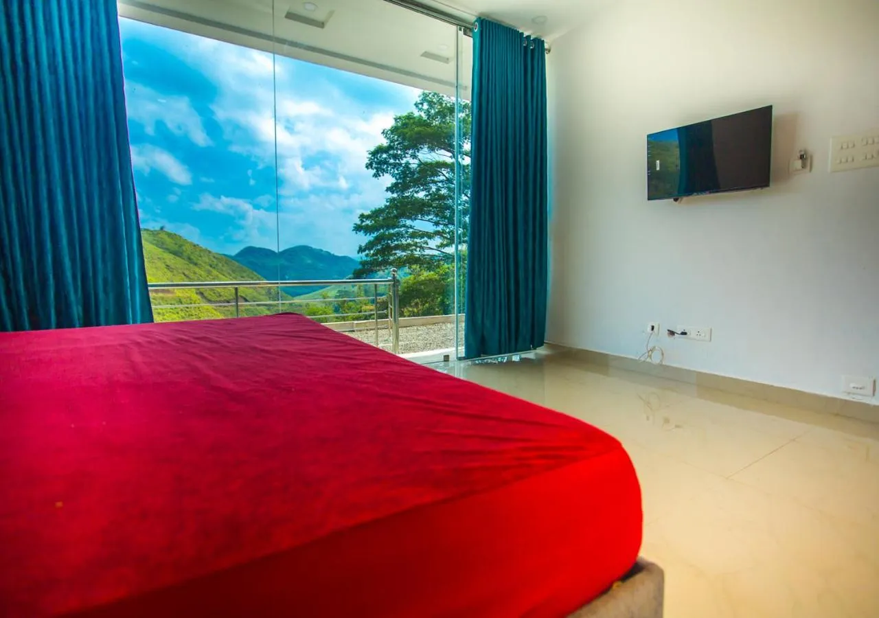 Communal lounge/ TV room, Bed in Hidden Valley Hill View Cottage Vagamon by VOYE HOMES - Rooms with Valley View