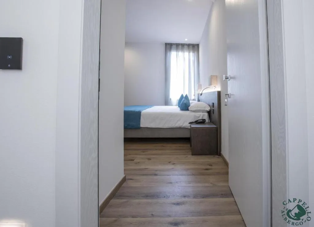 Bed in Albergo Cappello e Cadore