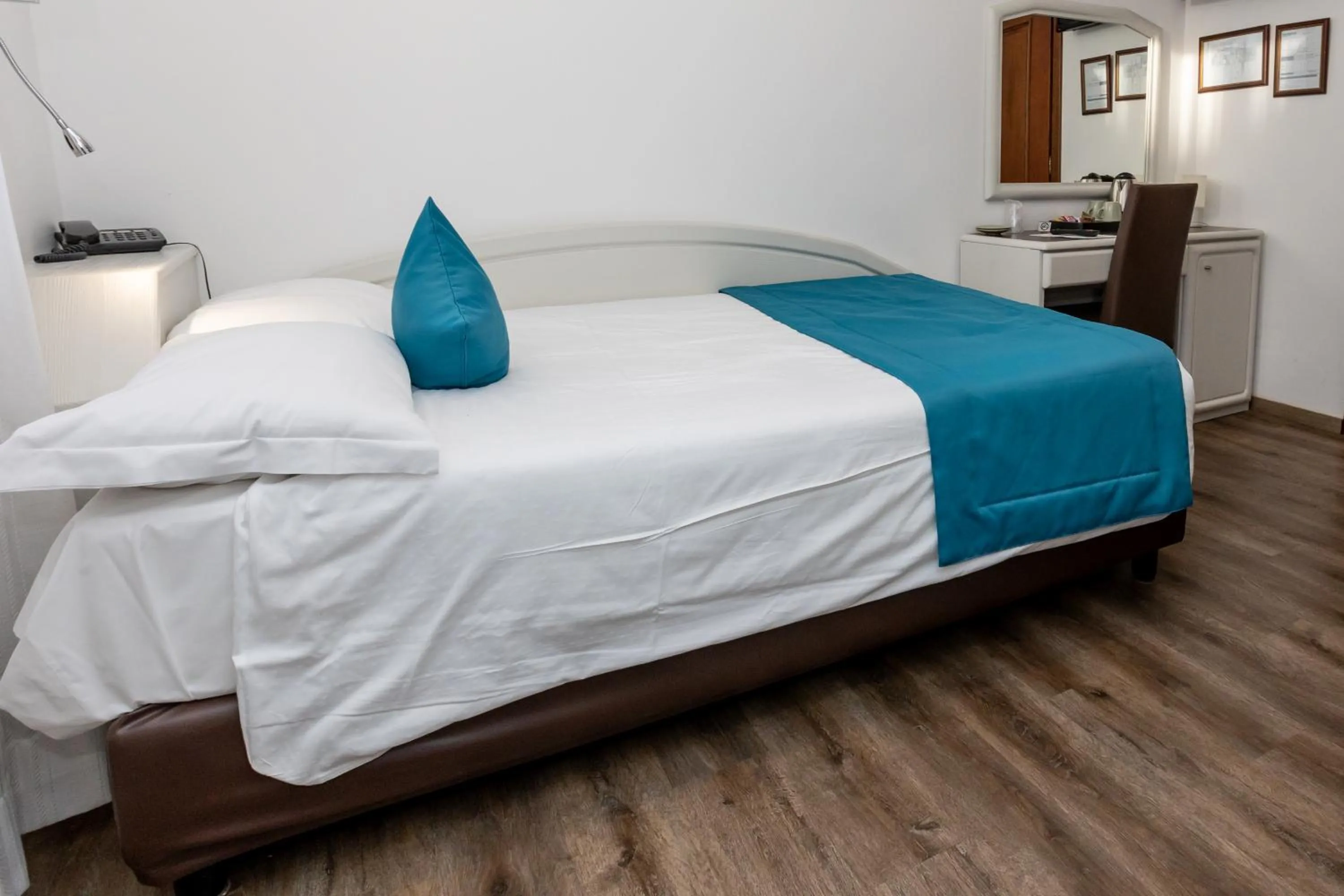 Bed in Albergo Cappello e Cadore