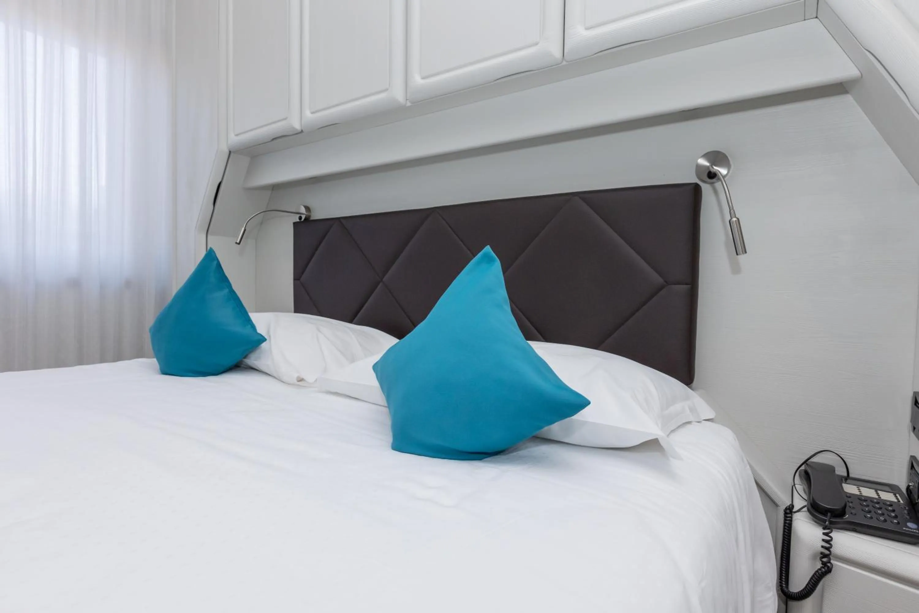 Bed in Albergo Cappello e Cadore