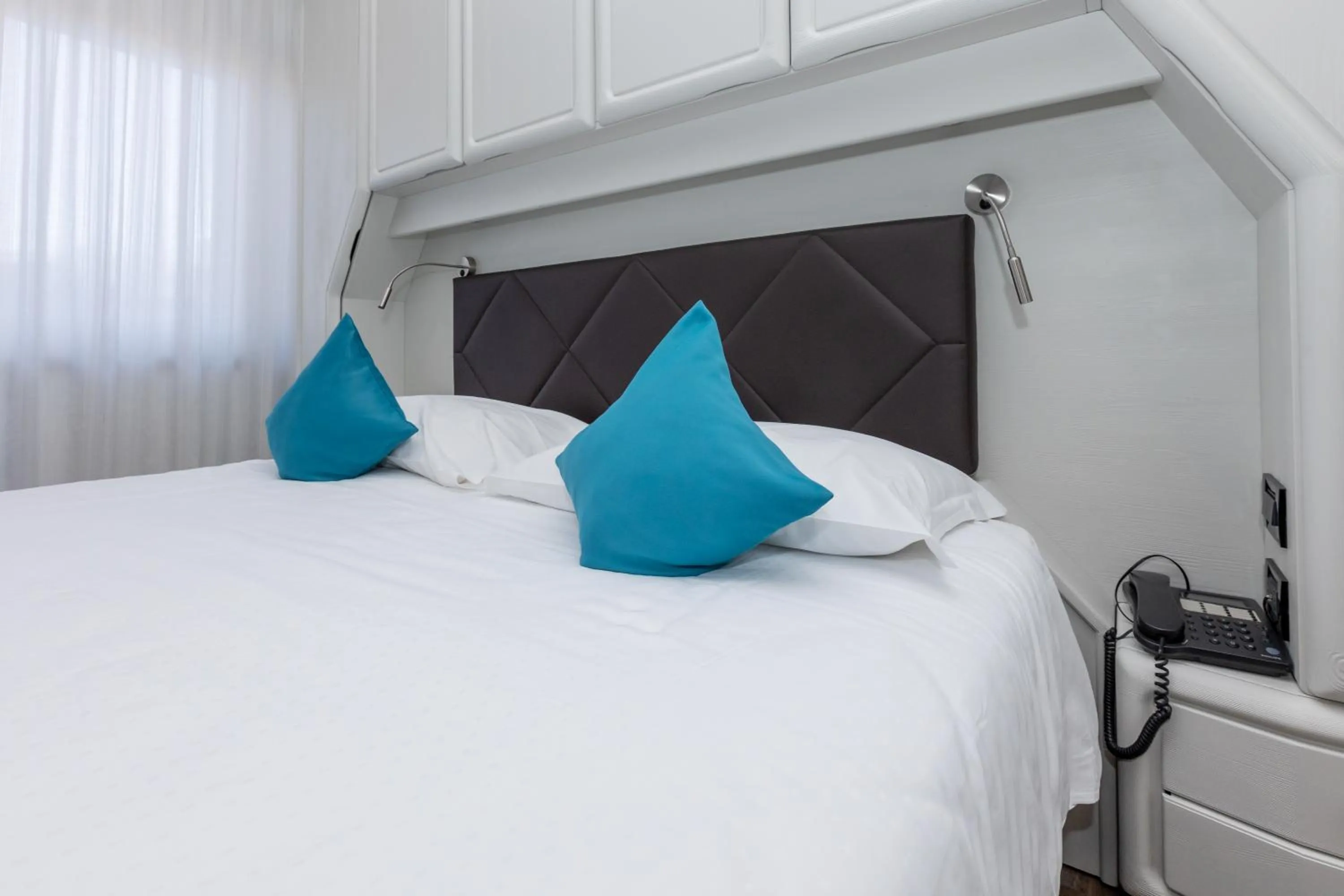 Bed in Albergo Cappello e Cadore
