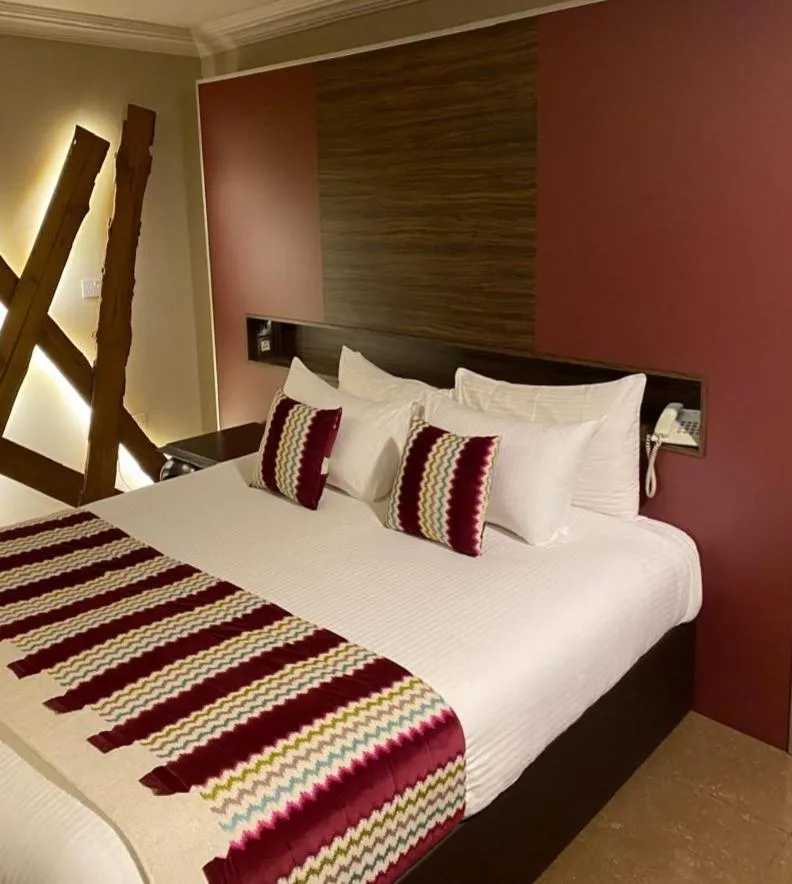 Bed in Home Suites Boutique Hotel Freetown