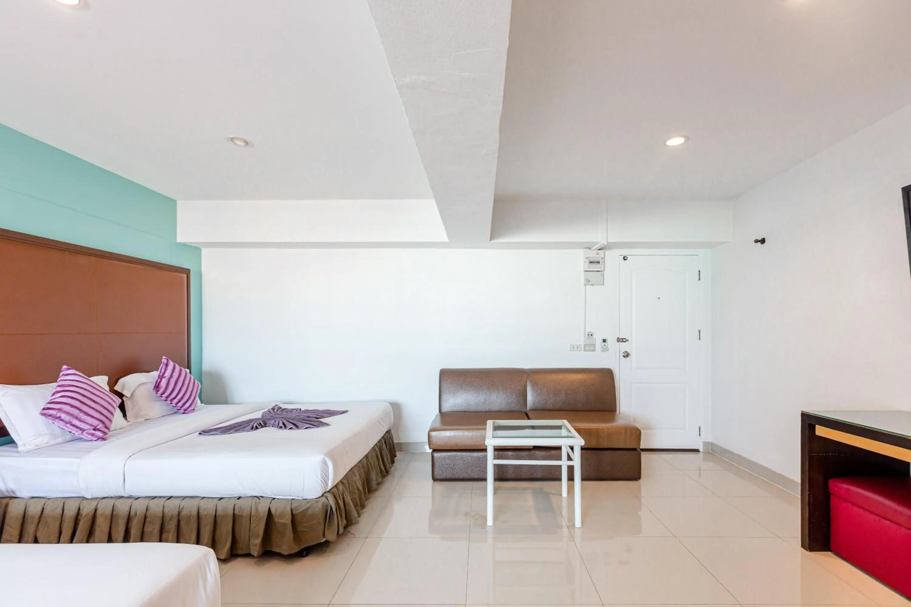 Bed in Latin Garden Hotel