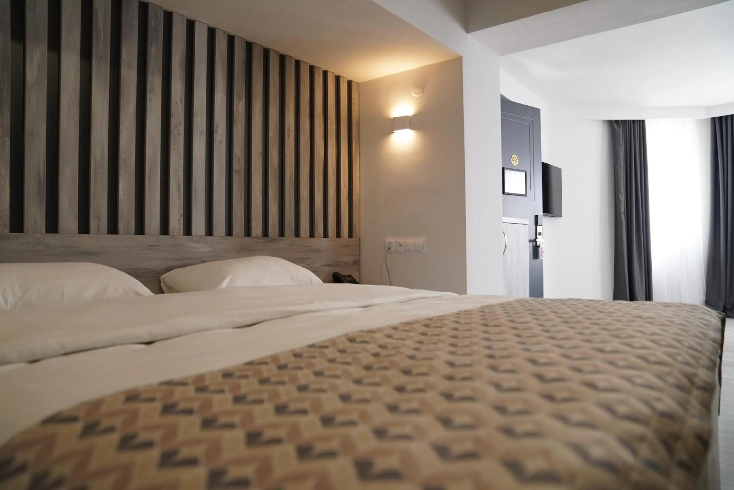 Bed in Aventus Hotel