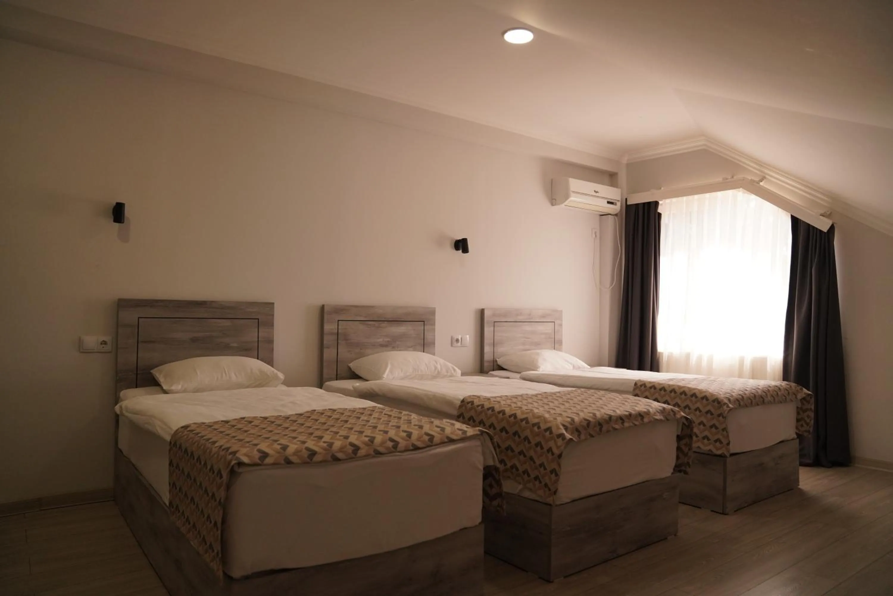 Bed in Aventus Hotel