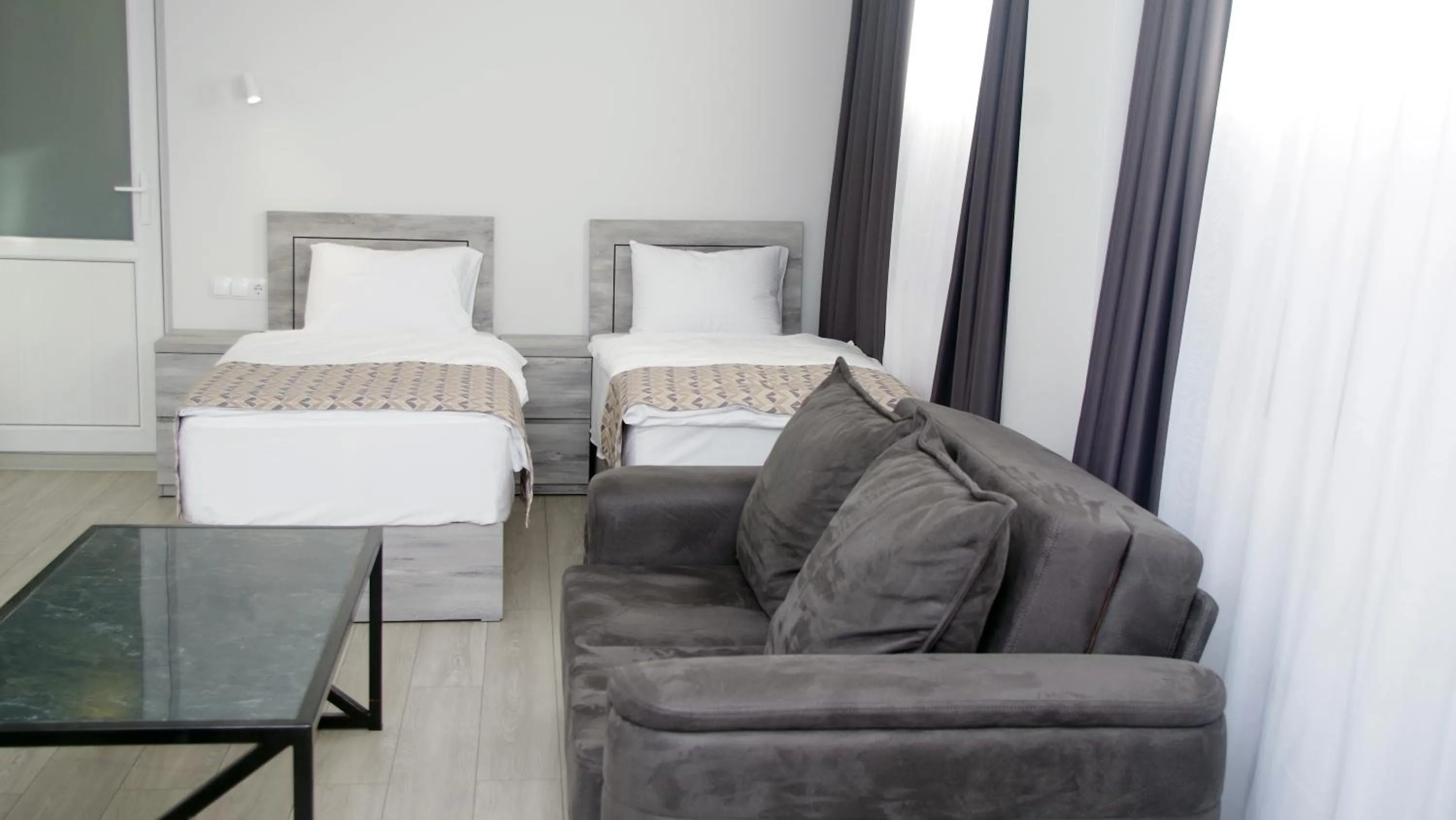 Living room, Bed in Aventus Hotel