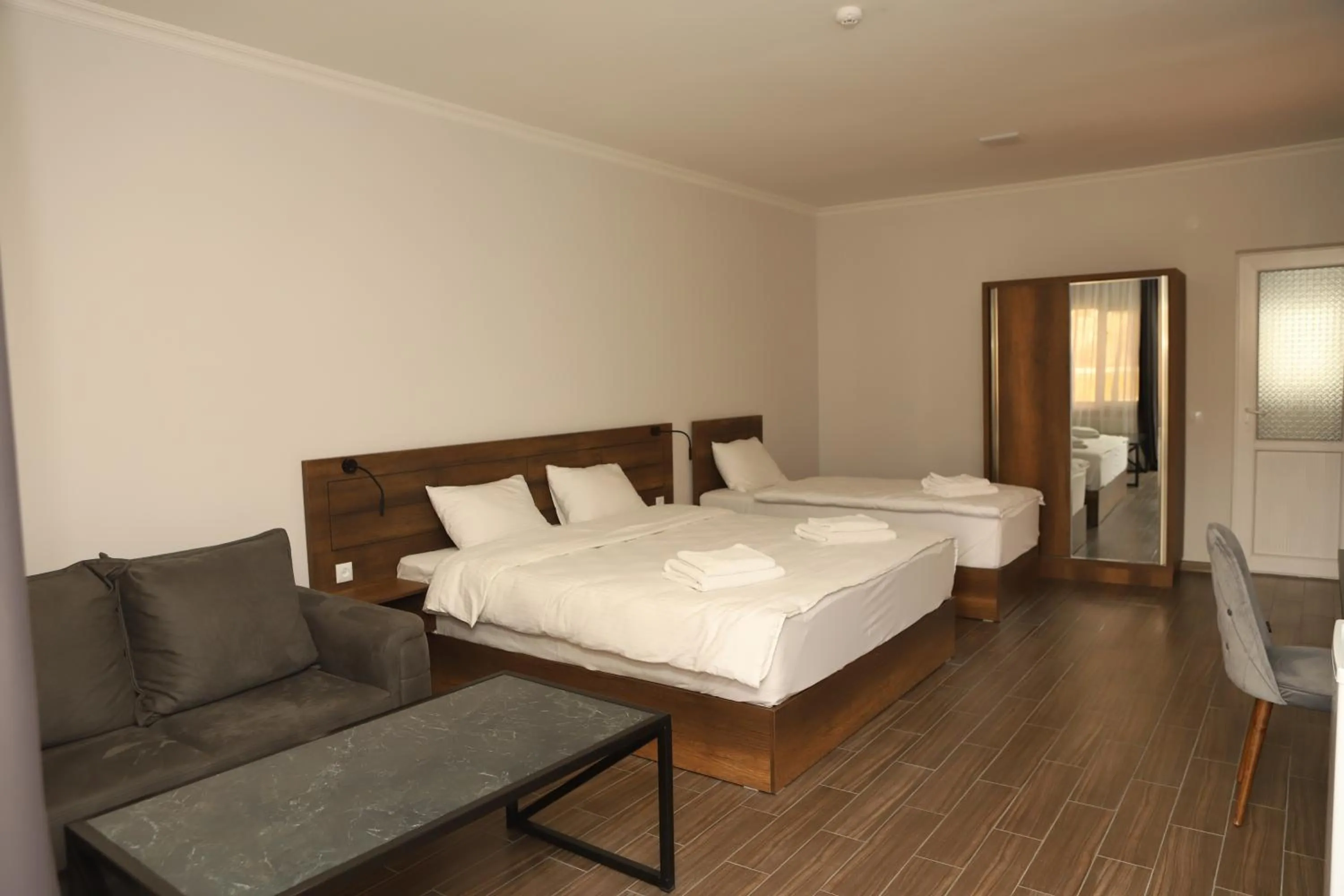 Living room, Bed in Aventus Hotel