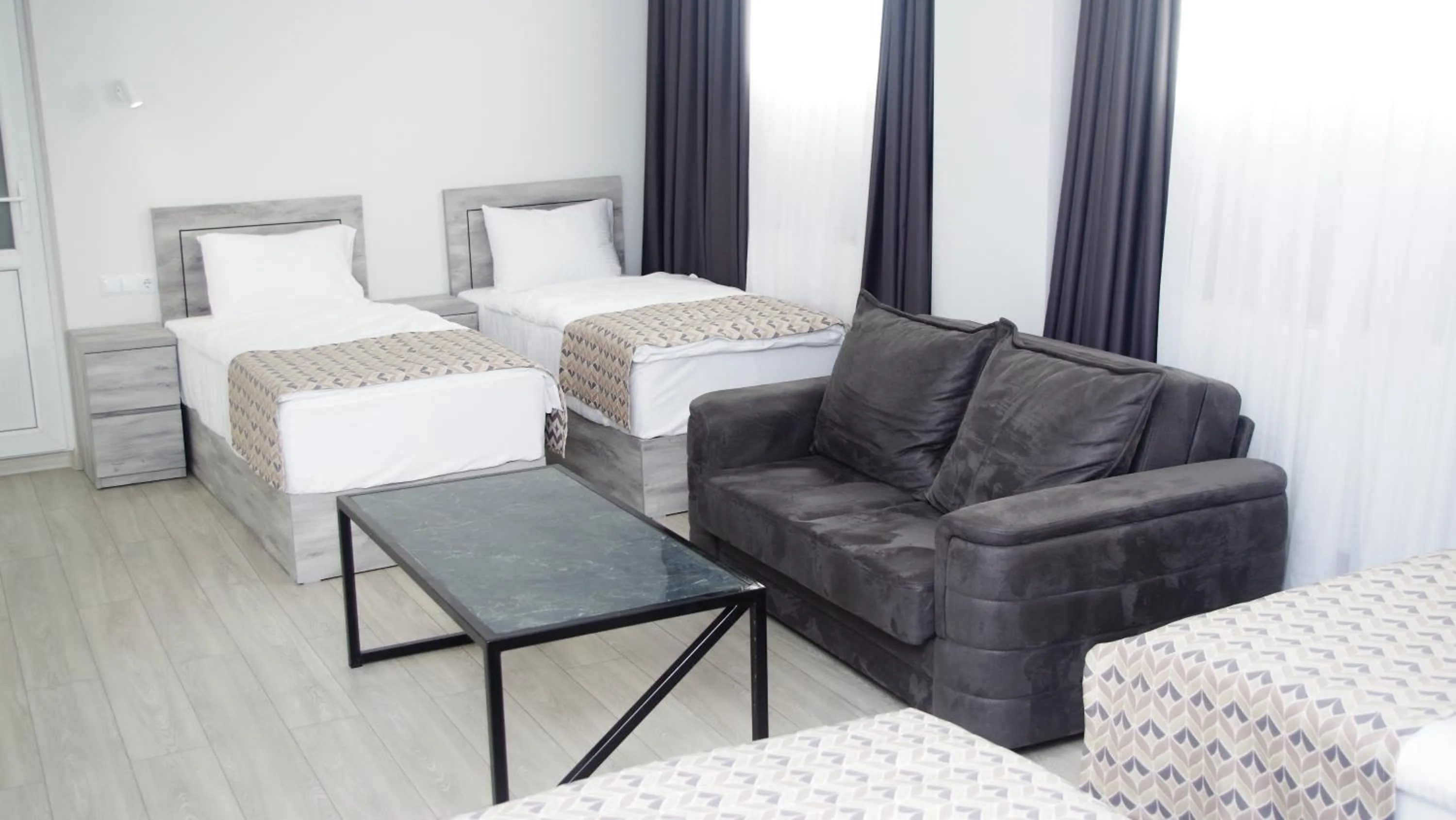 Living room, Bed in Aventus Hotel