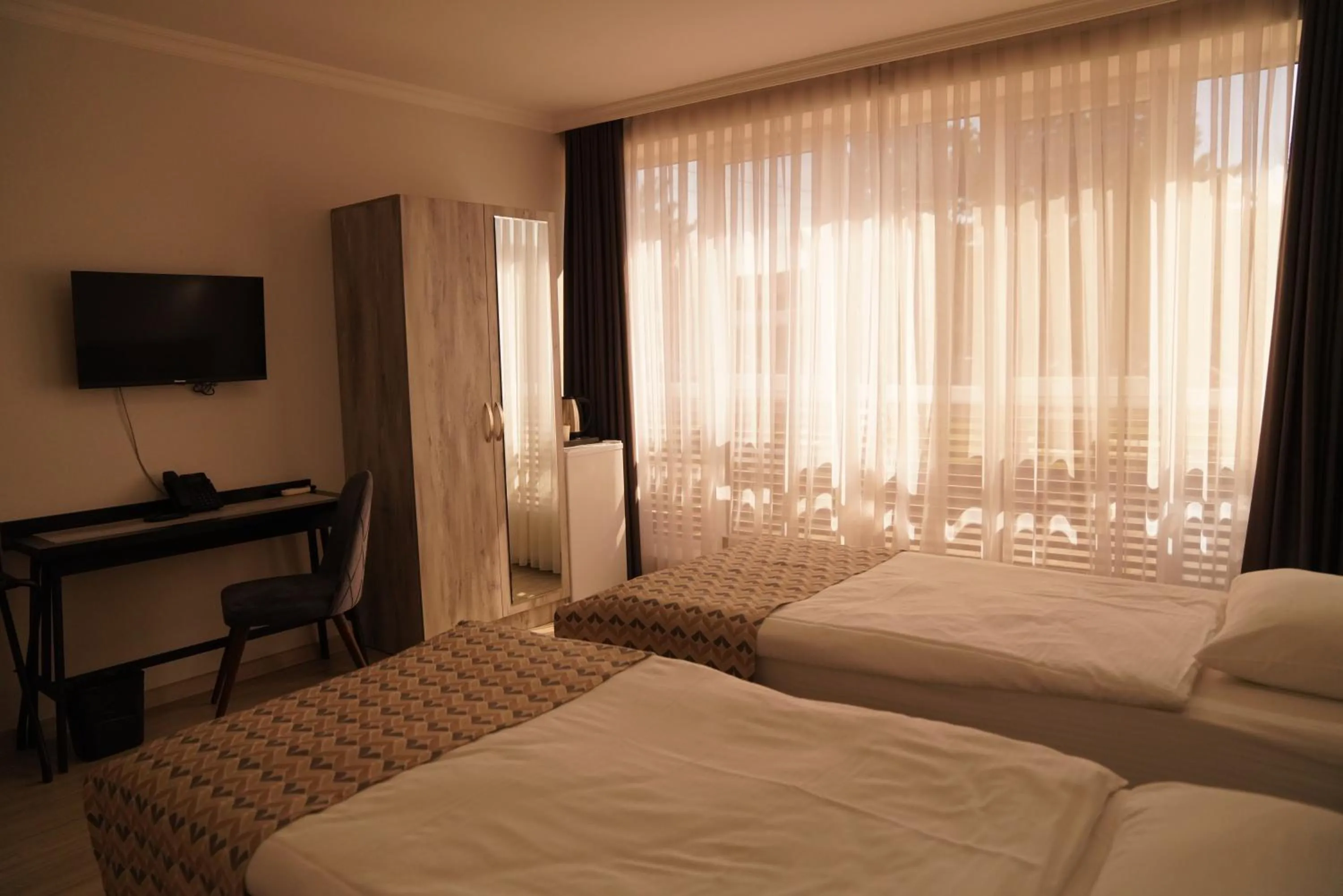 Bed in Aventus Hotel